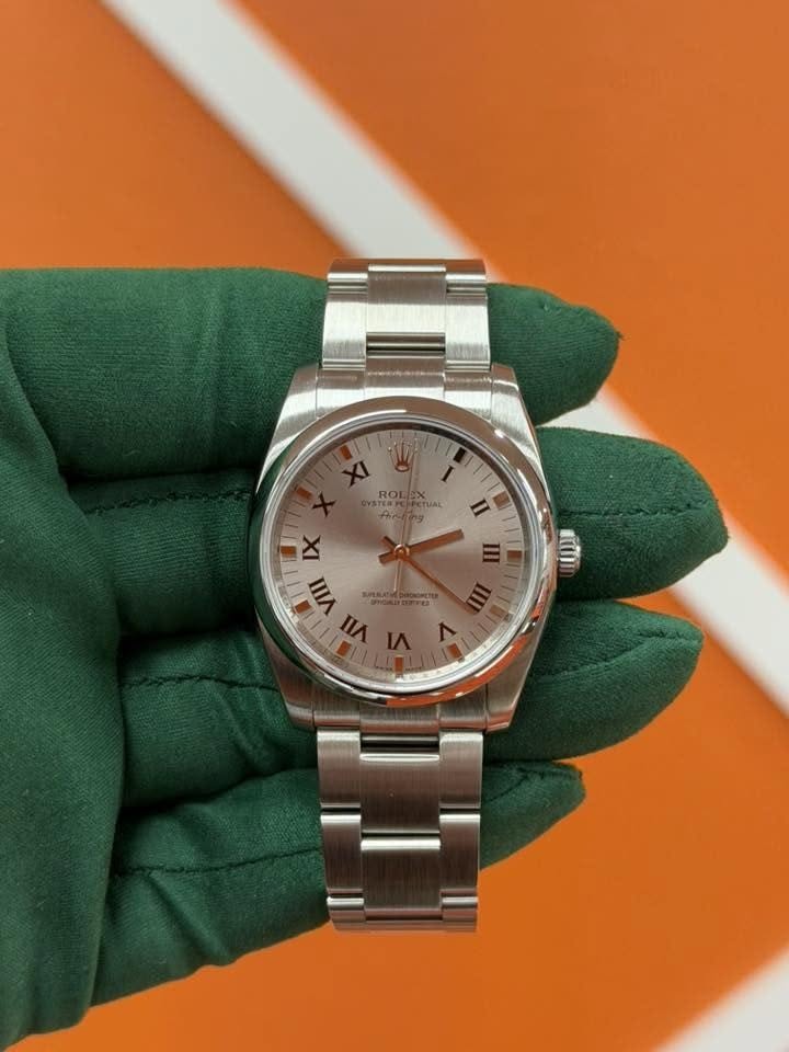 May be an image of wrist watch and text