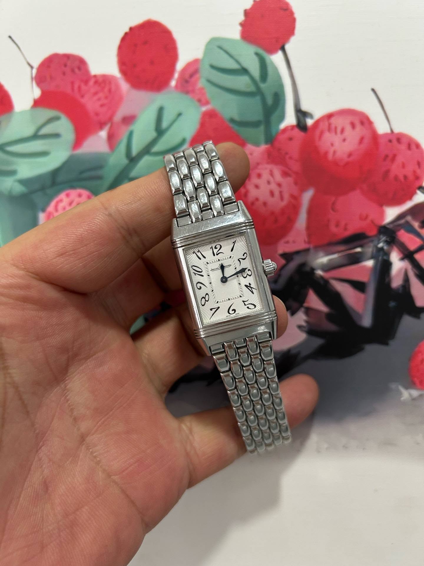 May be an image of wrist watch and text