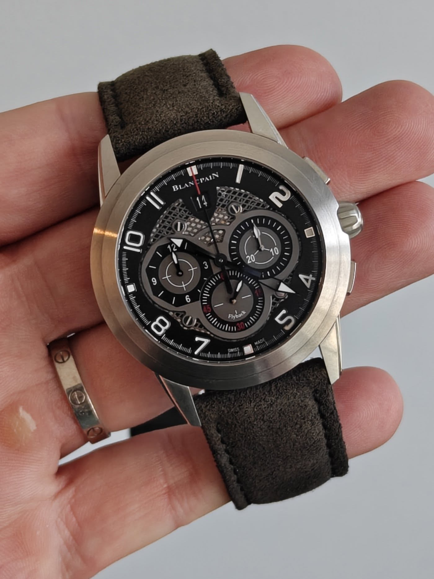 May be an image of wrist watch and text