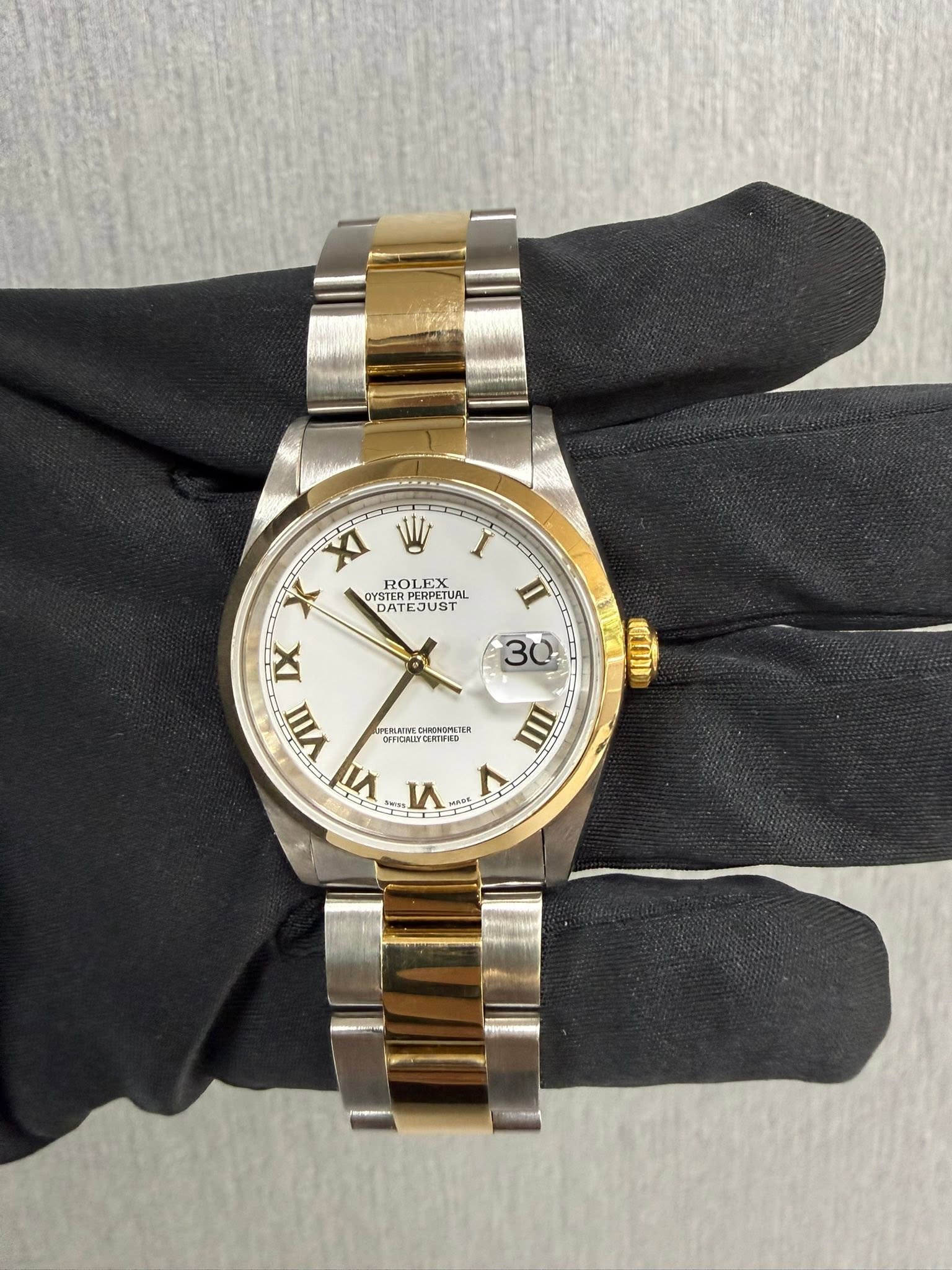 May be an image of wrist watch and text
