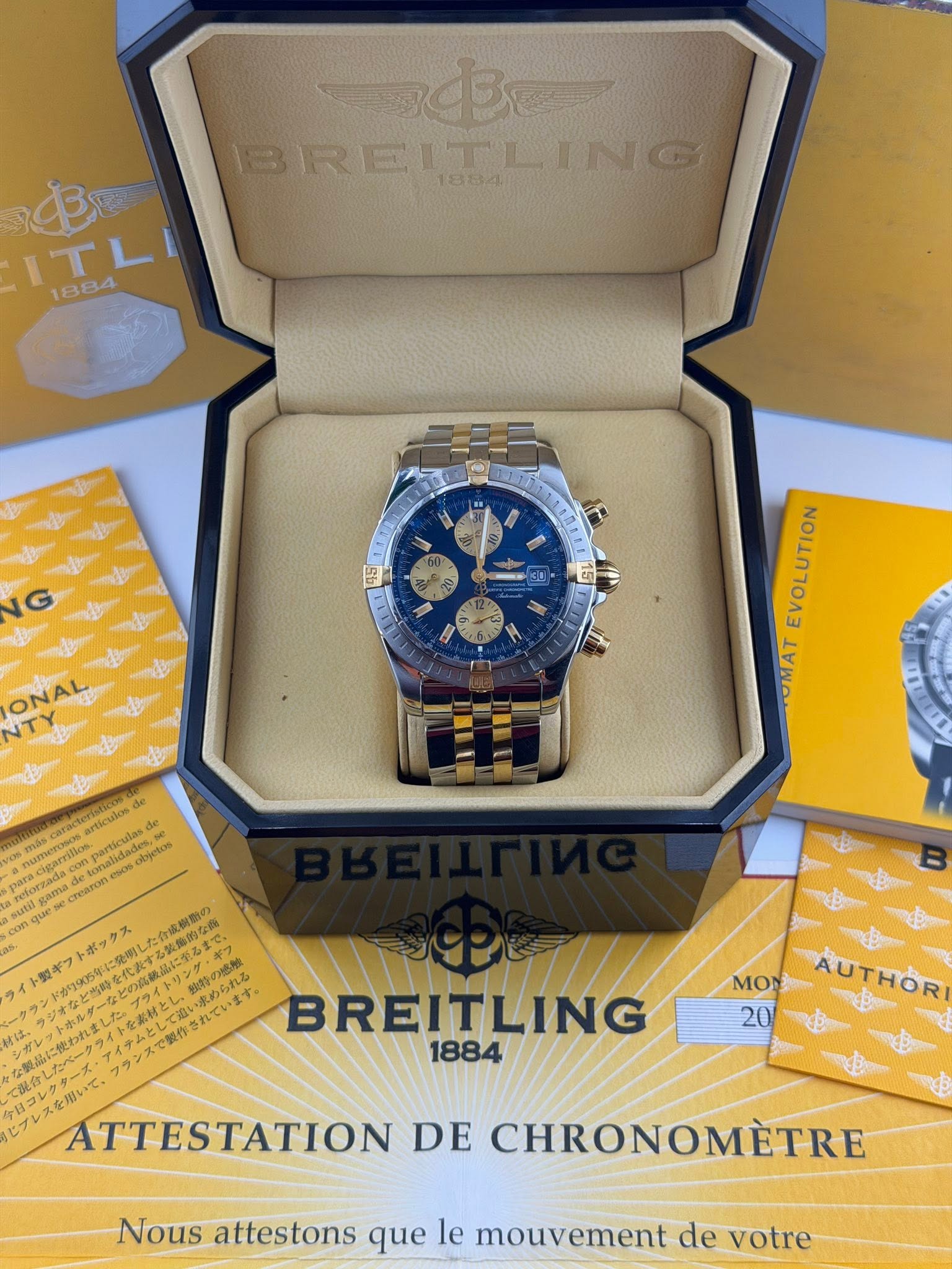 May be an image of wrist watch and text that says 'මරරනන B BRELT BREITLING tOAn 追 ITLI 1884 EVOLUTION OMAT cbjetos damilio reloszacia CCERTE Hengntrcem BREITLING 1884 MON AUTHOR 20…