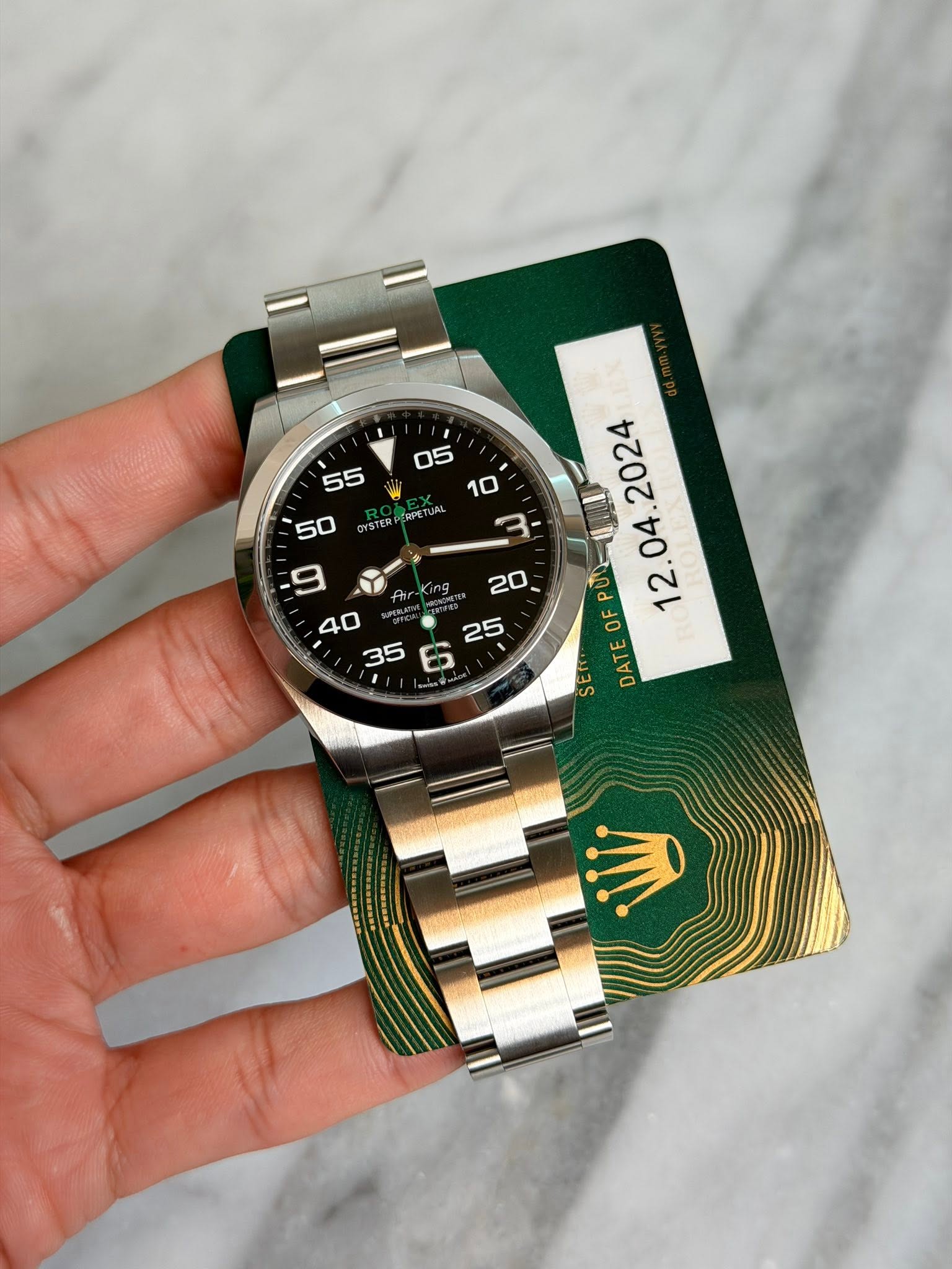 May be an image of wrist watch and text