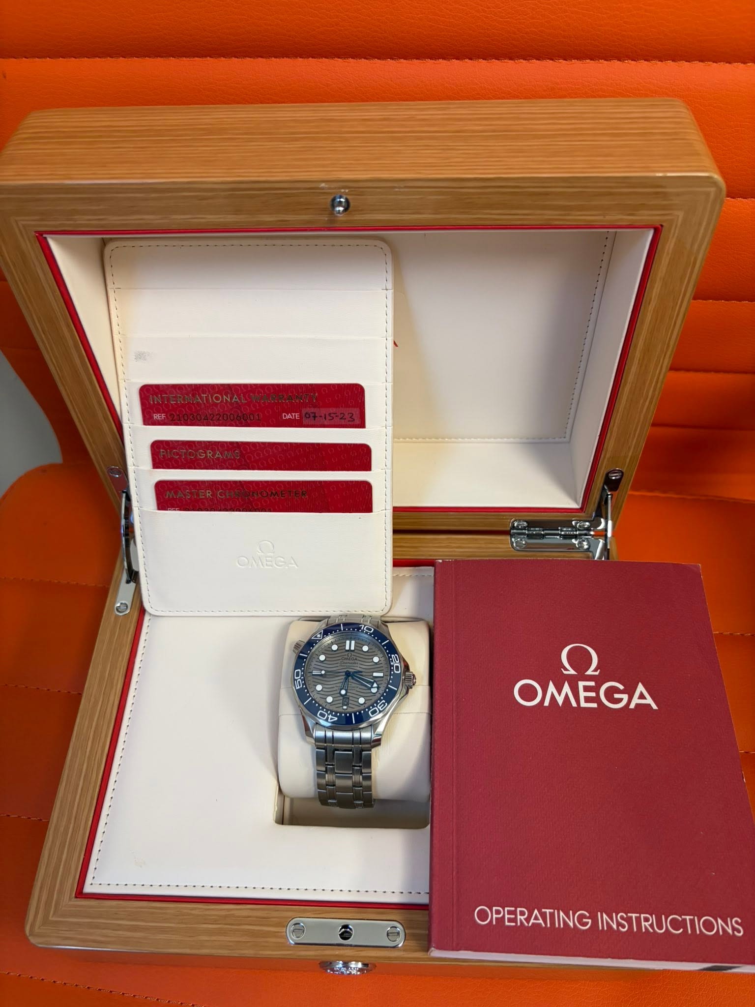 May be an image of wrist watch and text that says 'ONEGA 2P جر ח OMEGA OPERATING INSTRUCTIONS'