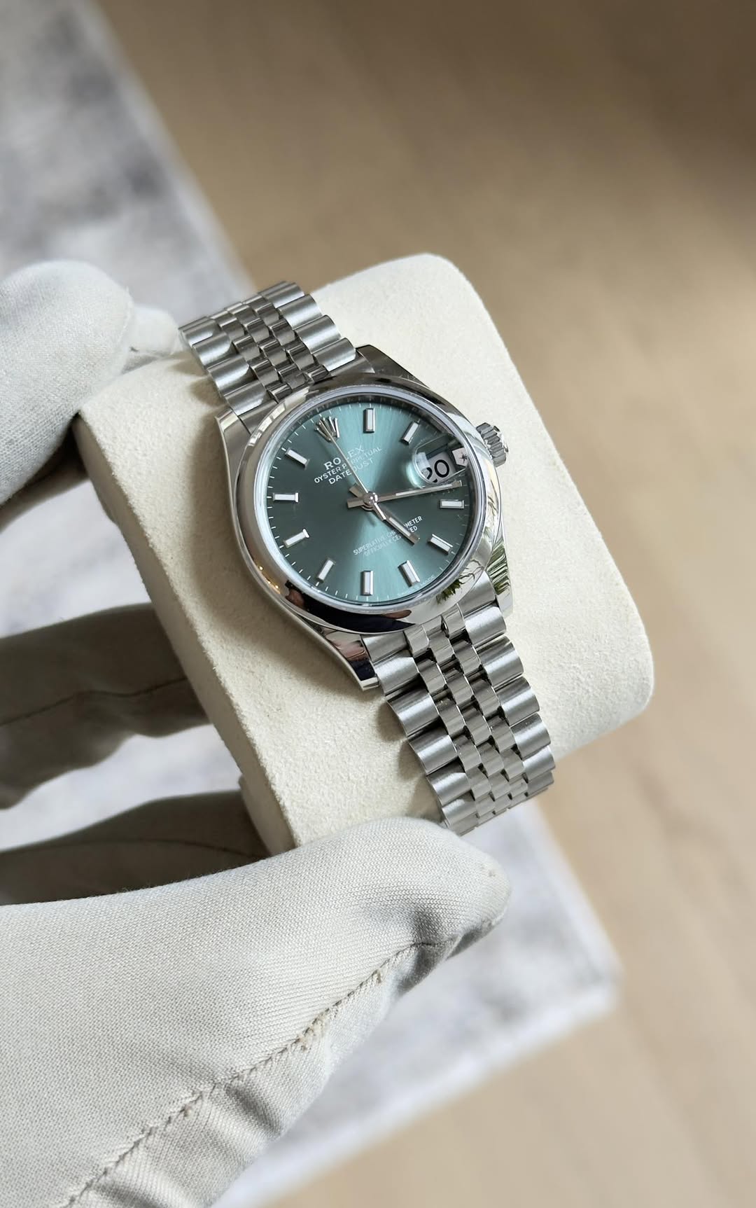 May be an image of wrist watch and text