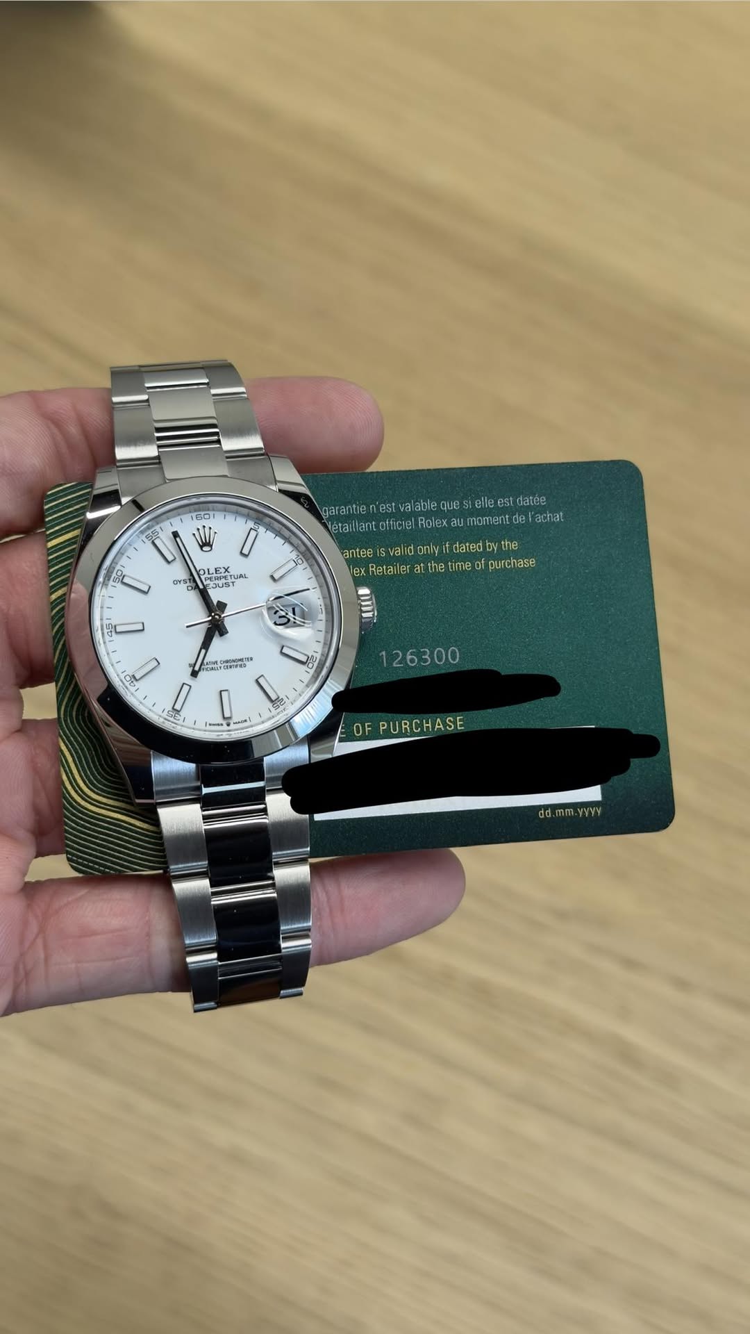 May be an image of wrist watch and text