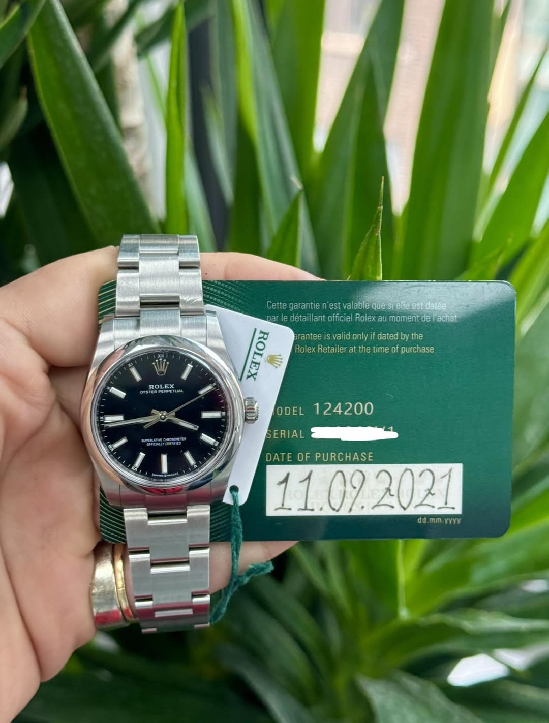 May be an image of wrist watch and text