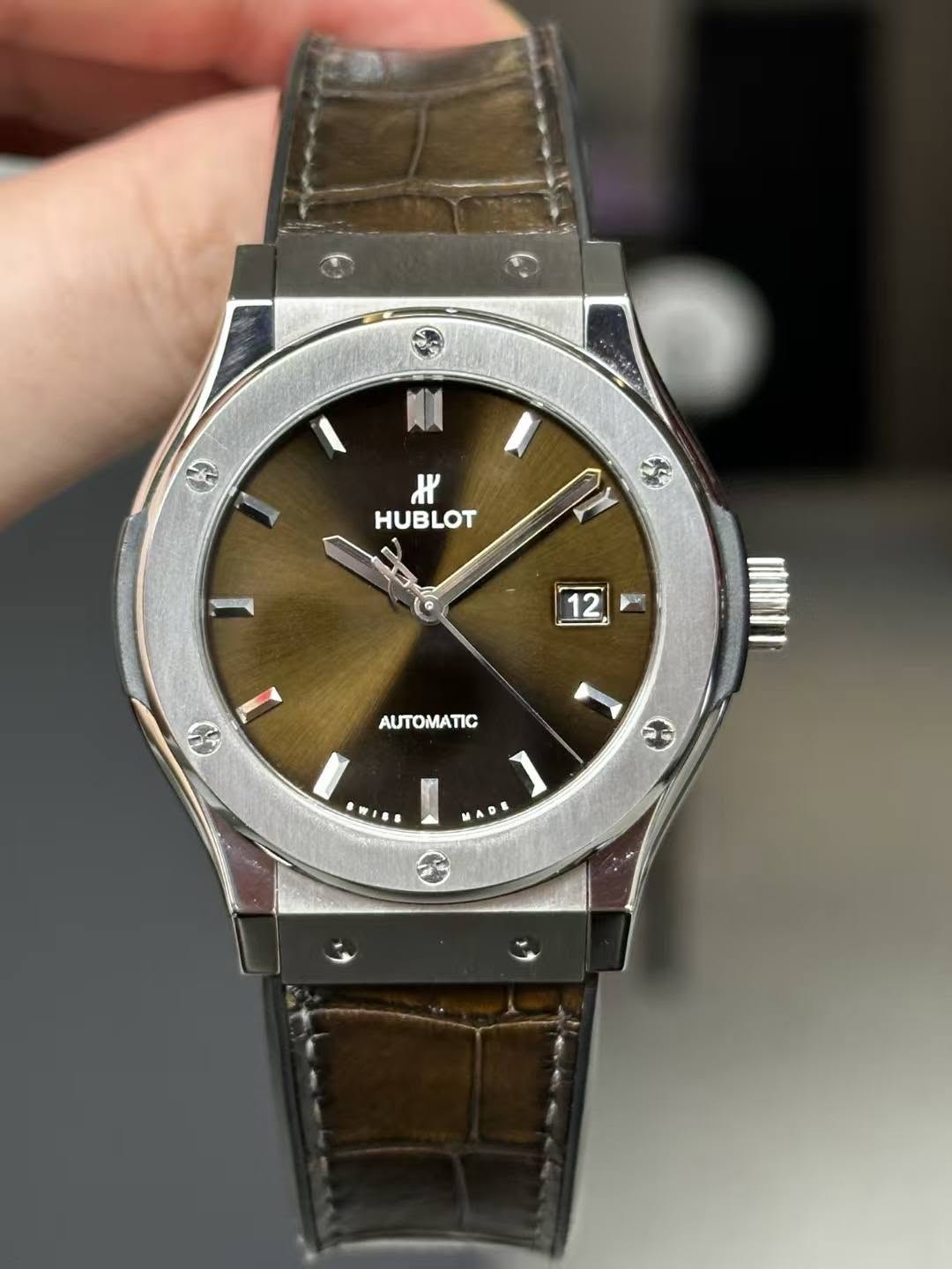 May be an image of wrist watch and text