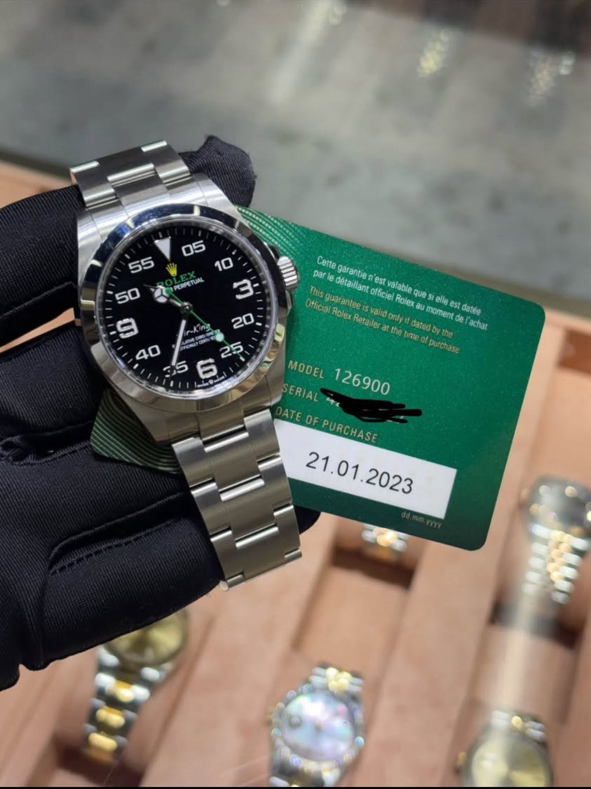 May be an image of wrist watch and text that says '55 50 PEBPETUA 05 10 3 ทง 20 - CNUP 25 6 II parle detaillant Catte garantie est guar officiel valable Oflicial Rolex Retailer…