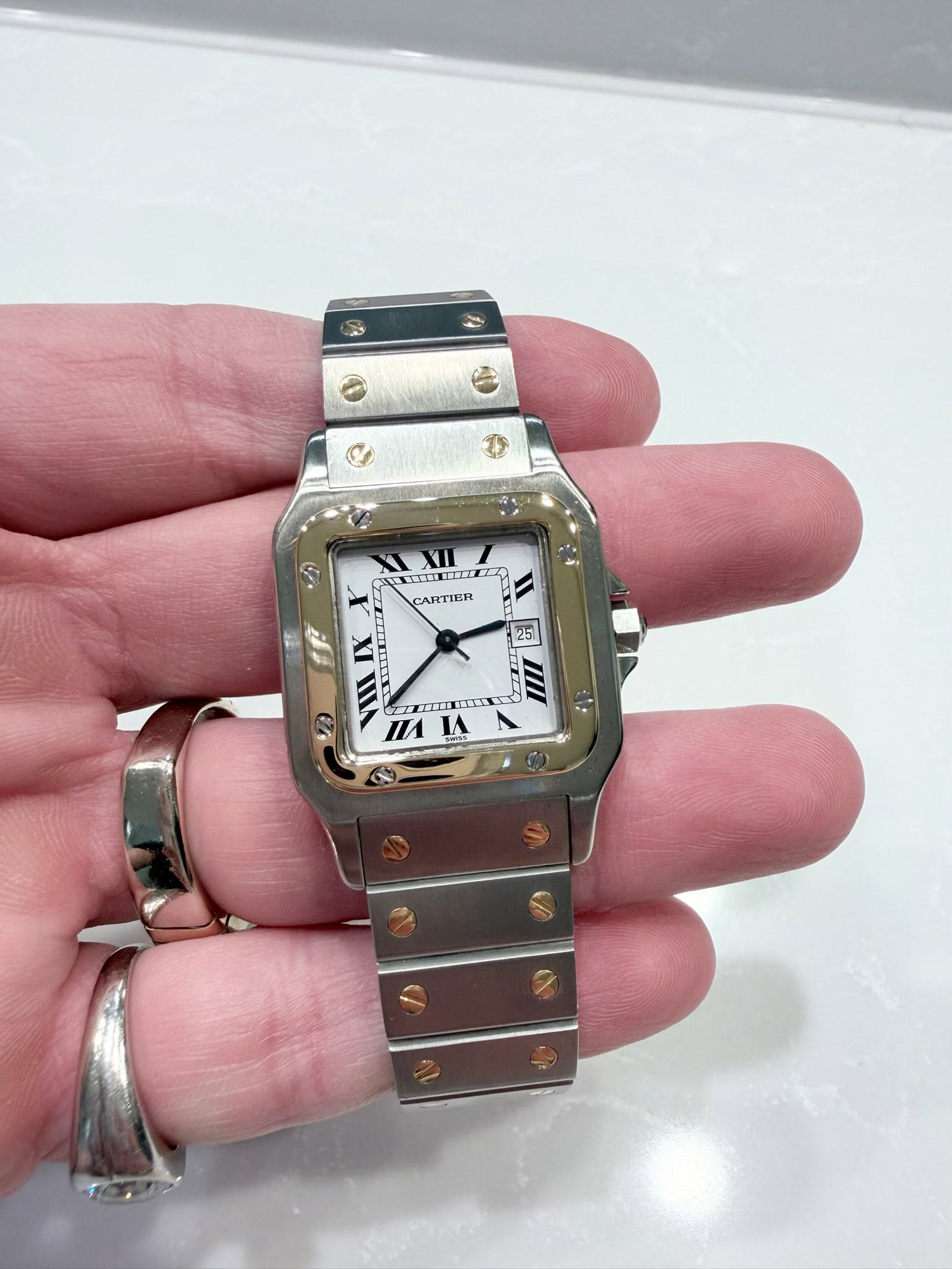 May be an image of digital watch and text