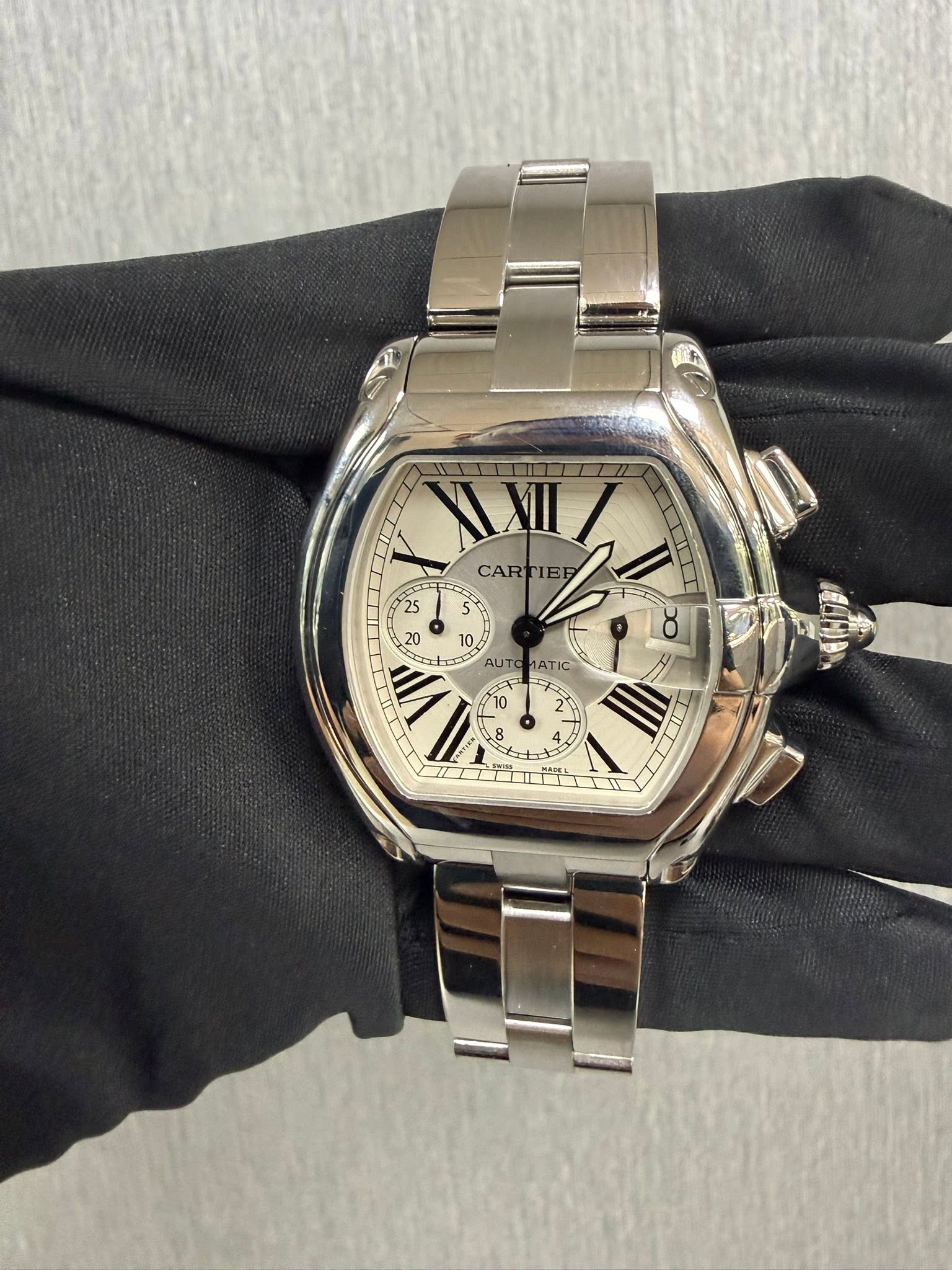 May be an image of wrist watch and text