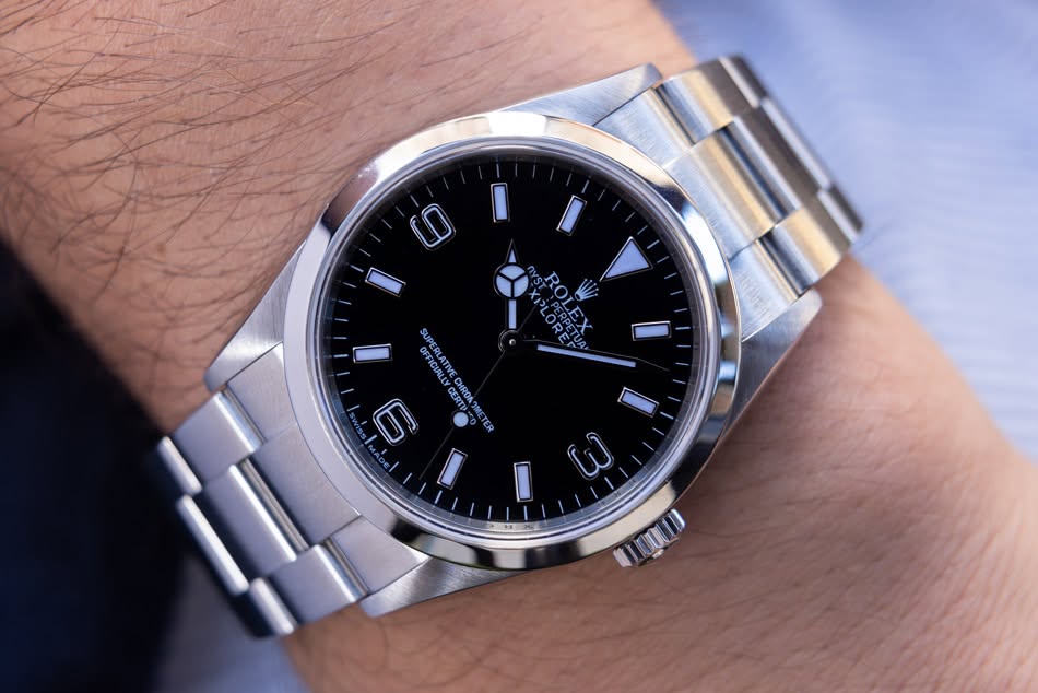 May be an image of wrist watch and text