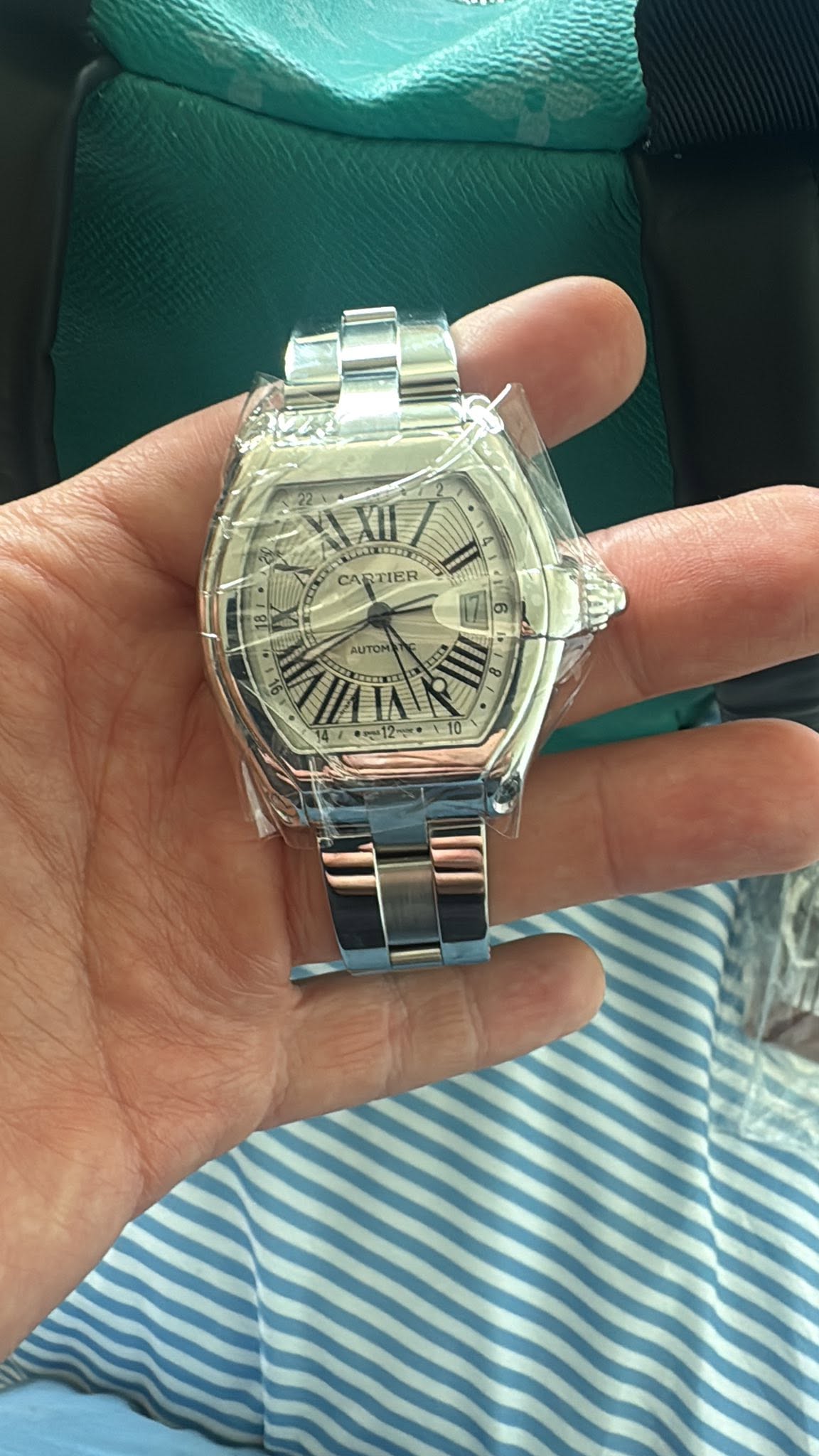 May be an image of wrist watch and text that says 'EXII XII CARTIER IAk WAINR ม UTON'