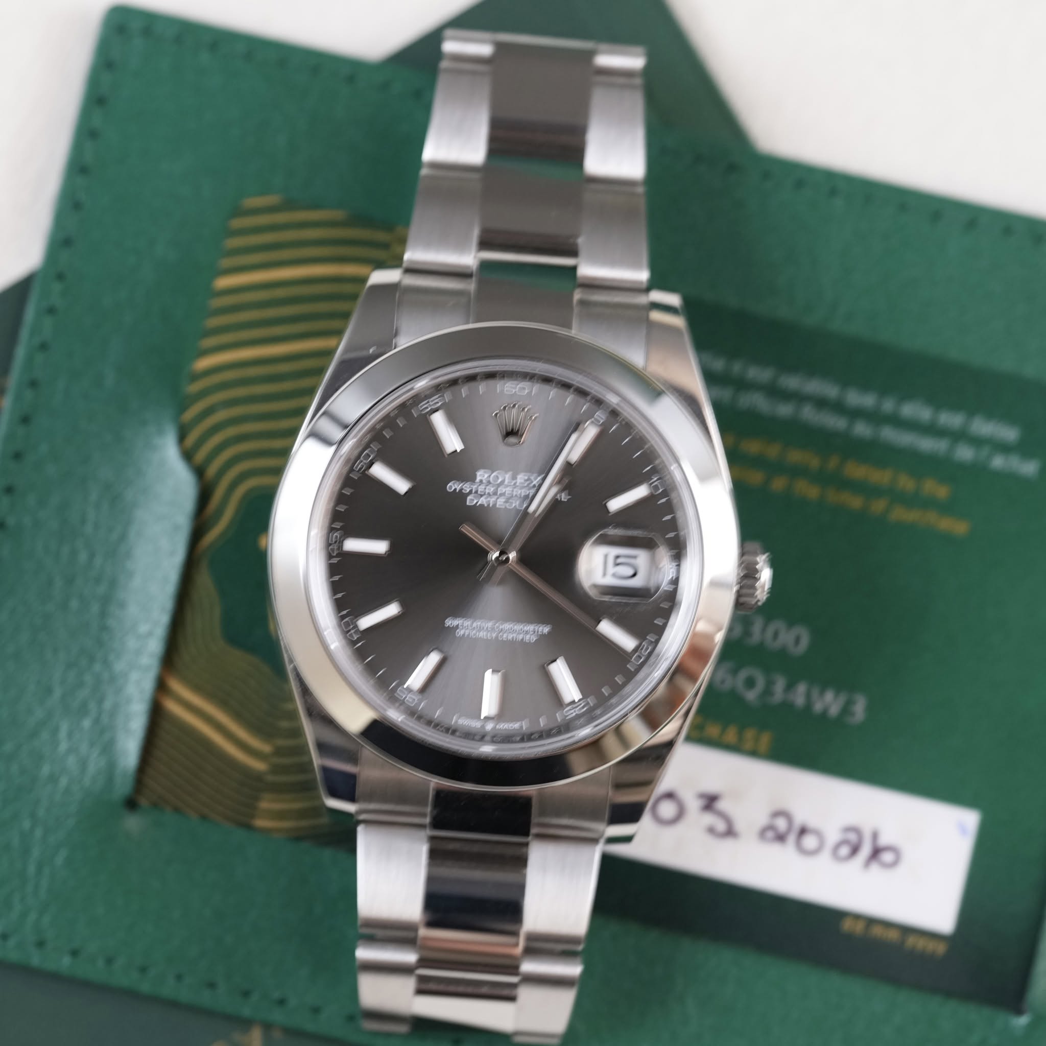 May be an image of wrist watch and text