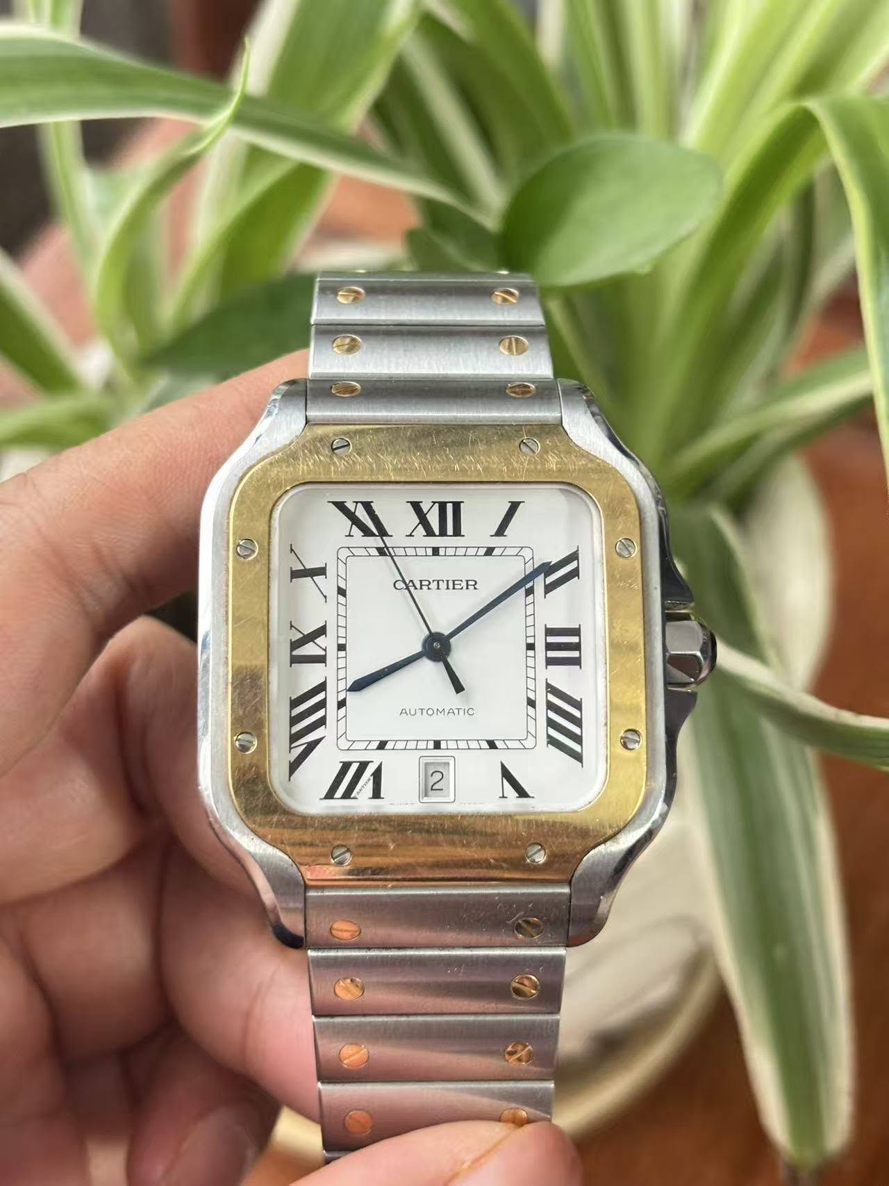 May be an image of digital watch and text that says 'CARTIER X XII XXIII I I ITH 圖 I A 一工 F III م D VII FI 1 げK ψ II 2 A AUT AUTOMATIC'