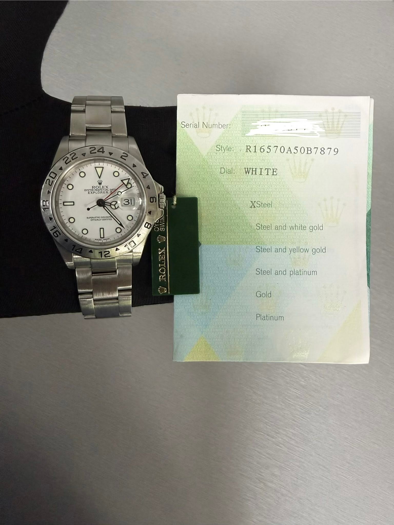 May be an image of money, ticket stub, wrist watch and text that says 'SerialNumber: Serial Number: 24 O Style: όHec ጠርርኒኒርን ROLEX LE 0t Dial: O O - o o R16570A50B7879 WHITE WH TE…