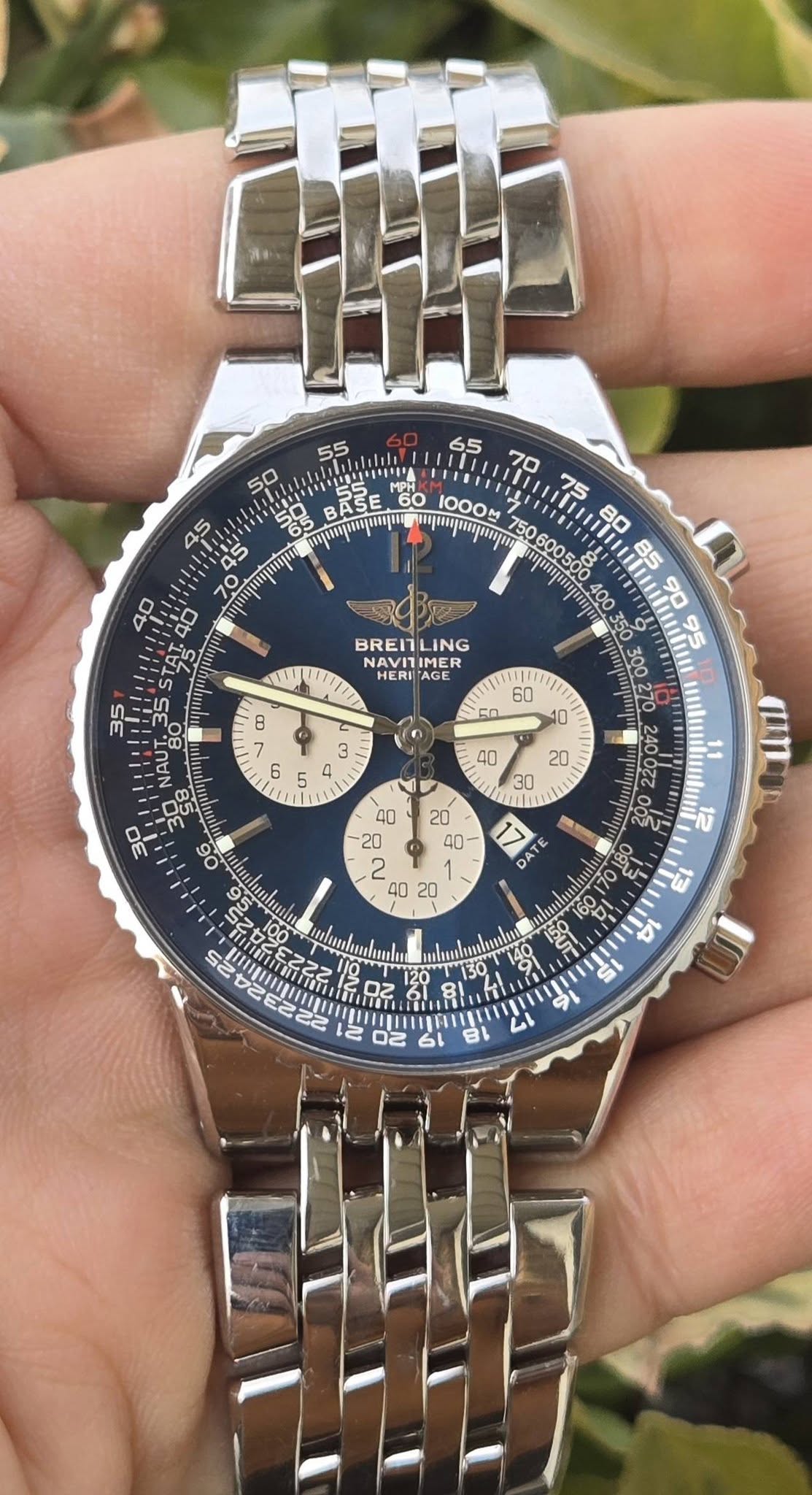 May be an image of wrist watch and text