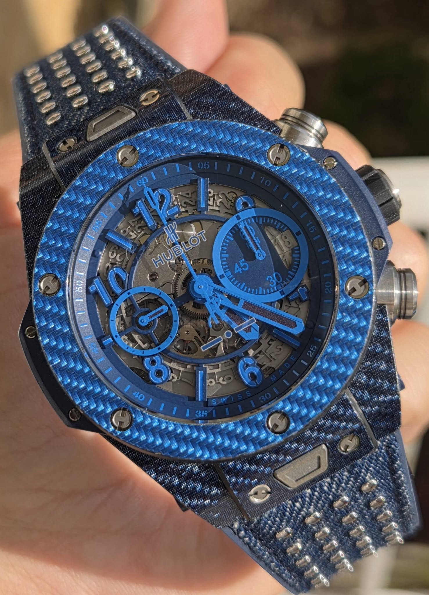 May be an image of wrist watch and text