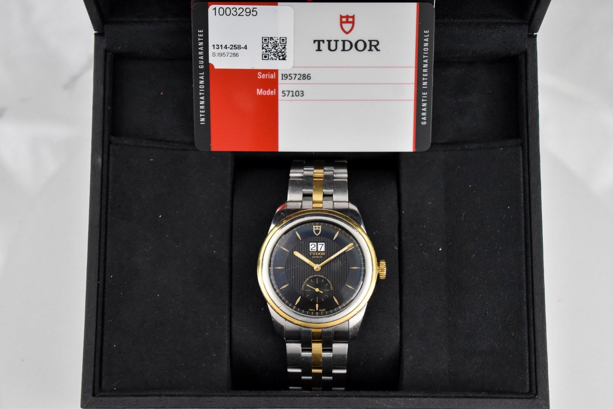 May be an image of wrist watch and text that says ' $1957286 A TUDOR Serial Serial1957286 1957286 Model57103 Model 57103 GARANTIE 円 27 0 acm'