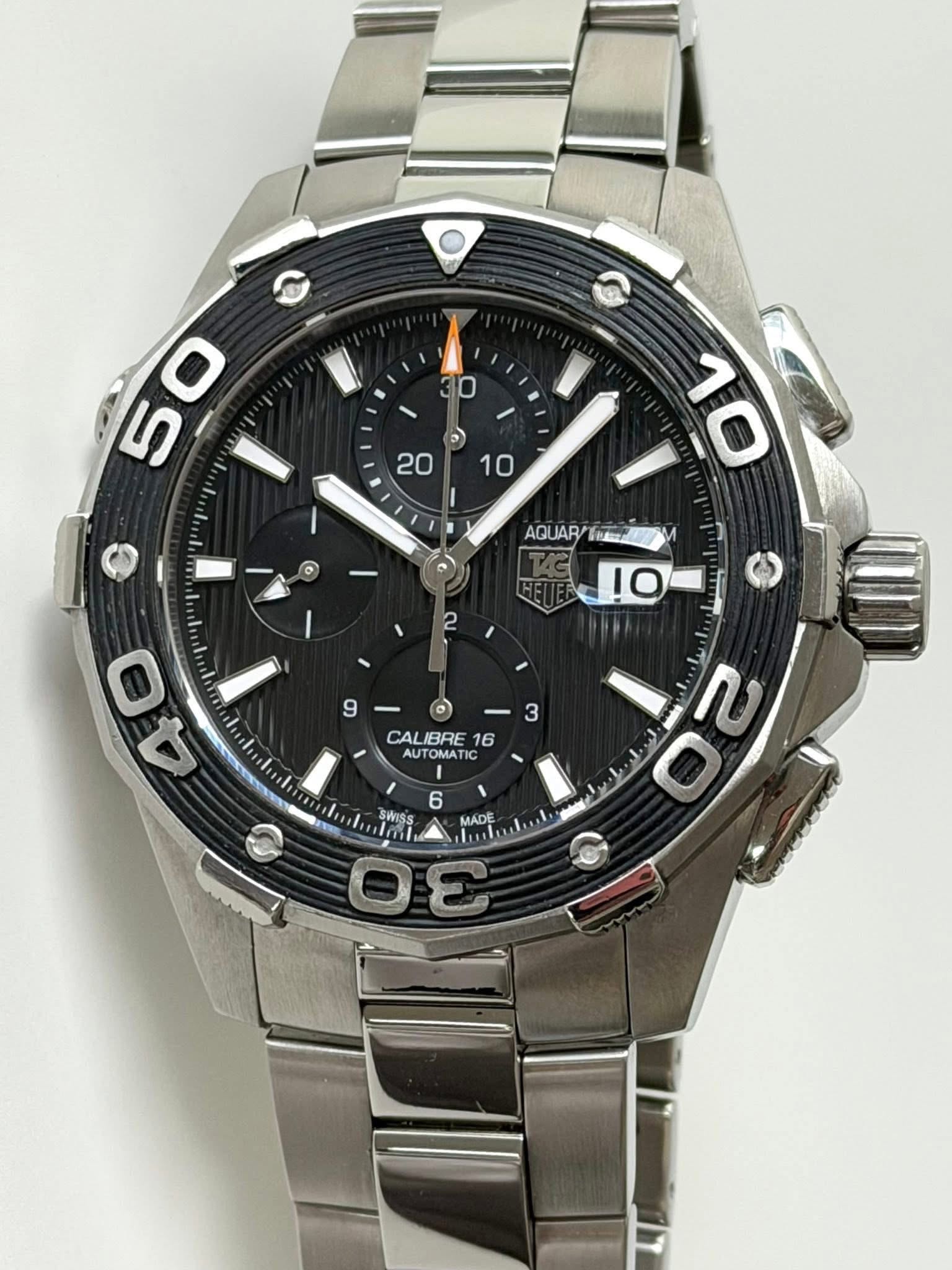 May be an image of wrist watch and text that says '30 5 50 D) 10 20 10 AGUARY AC UAR/ !O 2 9 - 3 CA CALIBRE 16 AUTOMAT OMATI nc AUTO 0 40 6 SWISs MADE Θε'