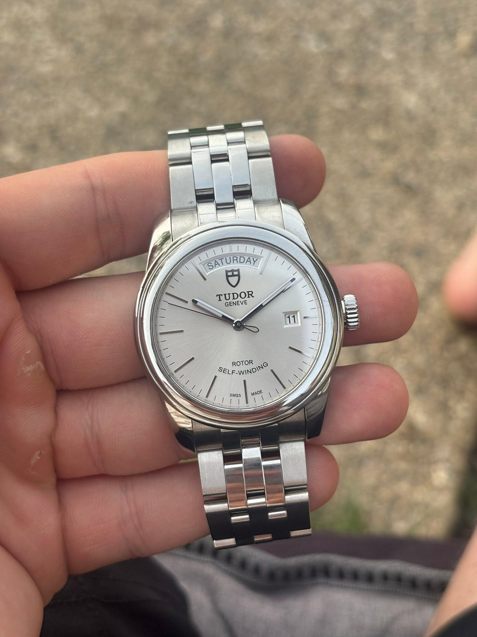 May be an image of wrist watch and text that says 'SATURDAY TUDOR GENEVE GENEVE 11 mii ROTOR SELF-WINDING SELF-WINDING WINDING SELF- SwSS MADK ICE'