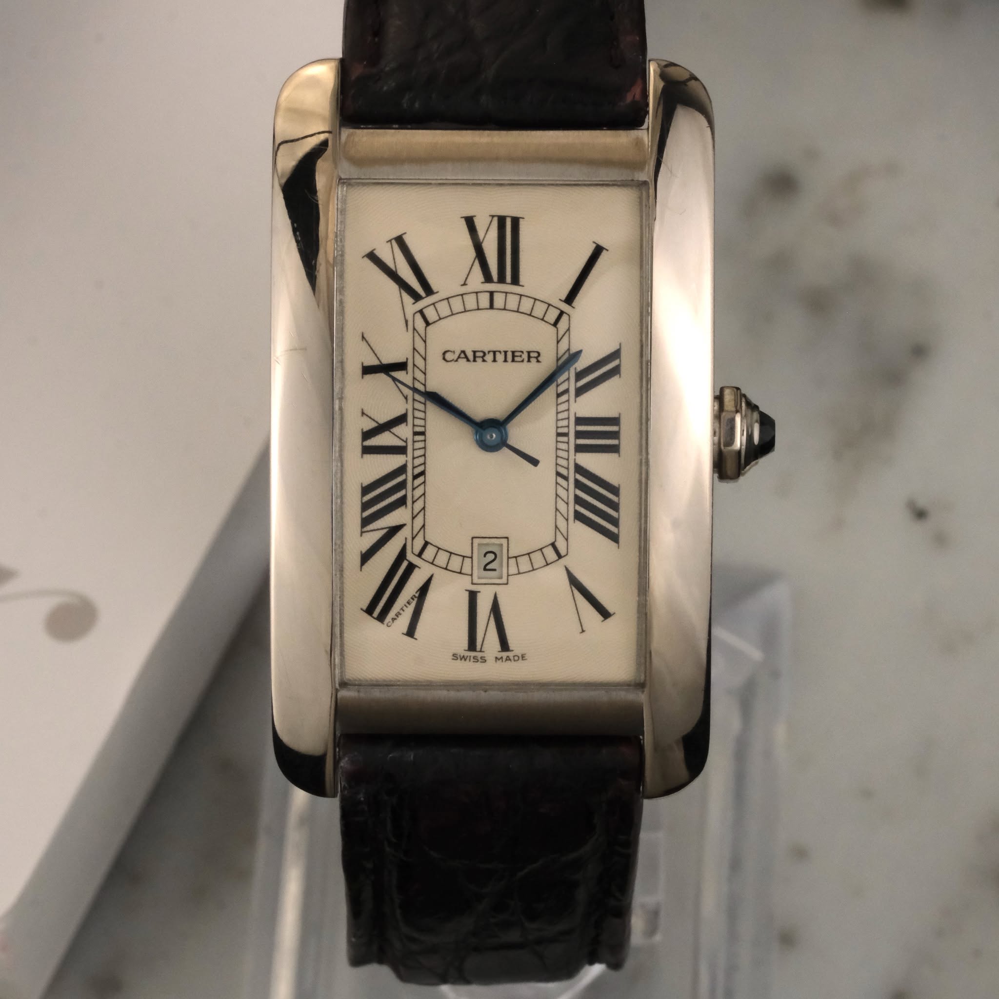 May be an image of wrist watch and text