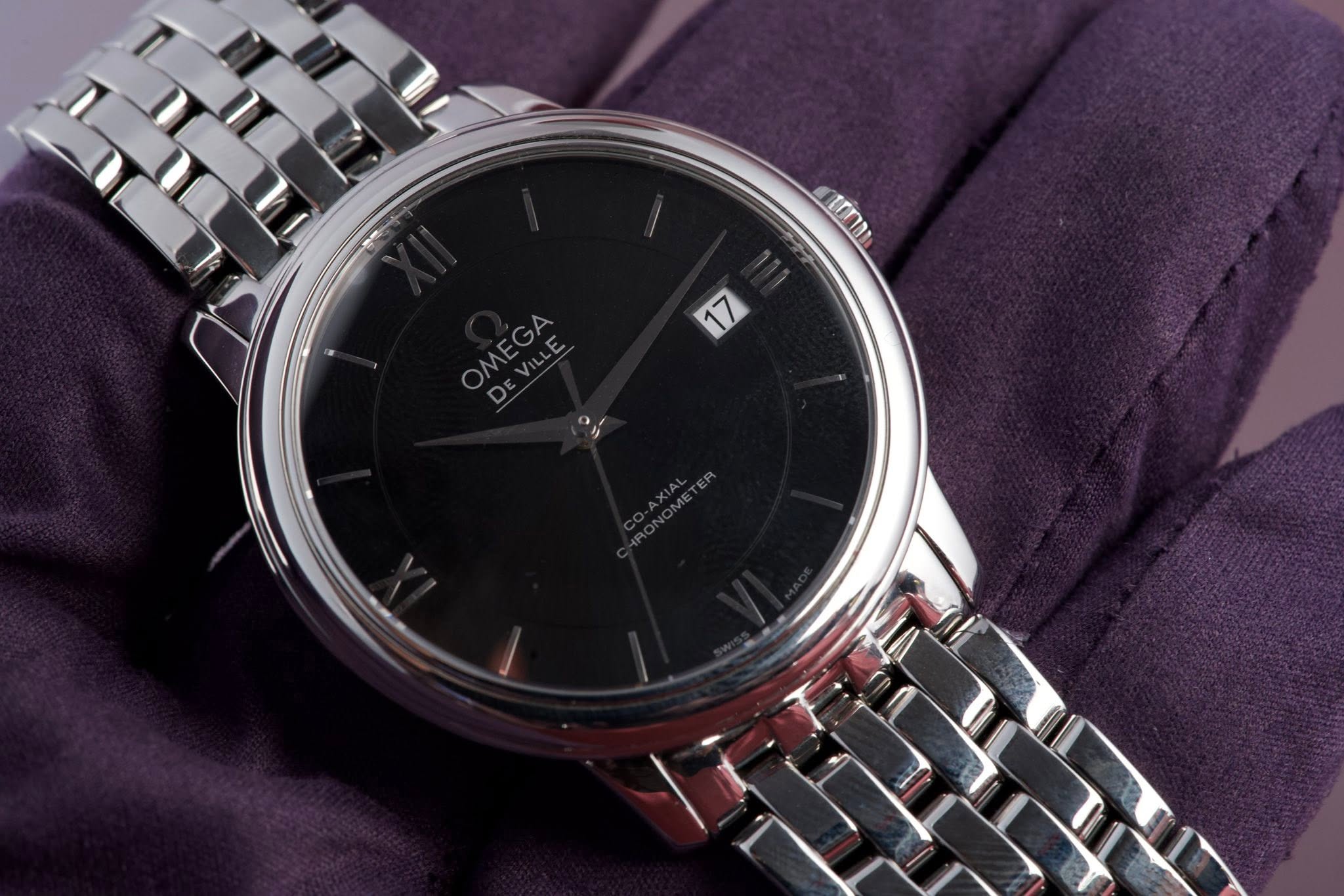 May be an image of wrist watch and text that says 'n K O'
