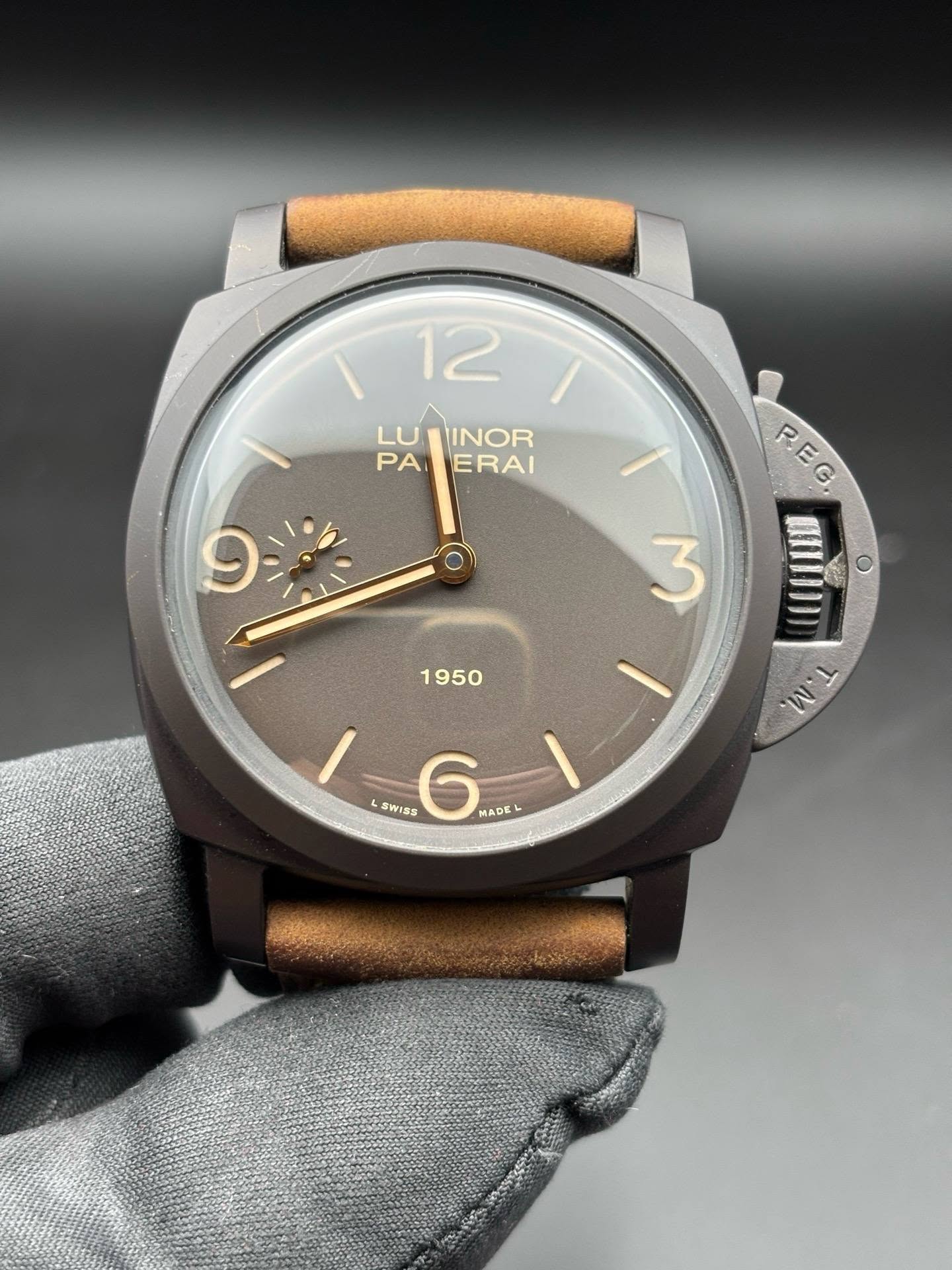 May be an image of wrist watch, leather and text