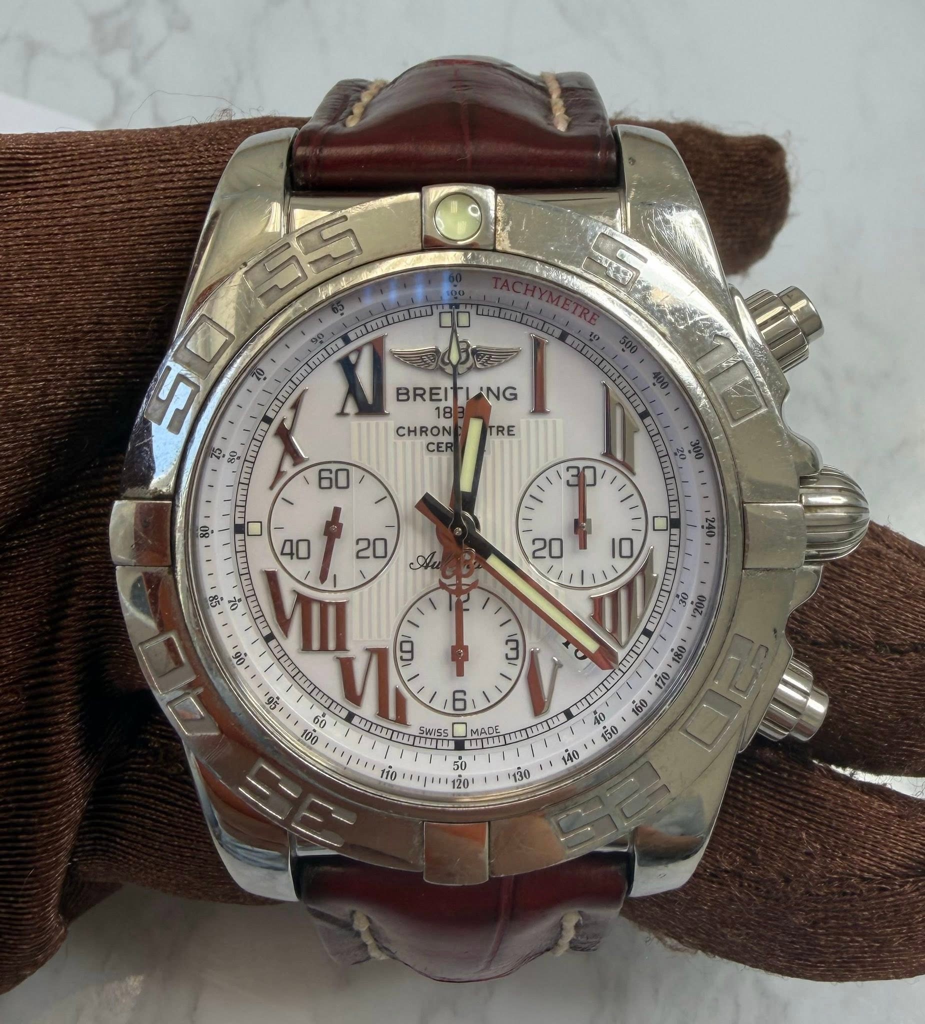 May be an image of wrist watch and text