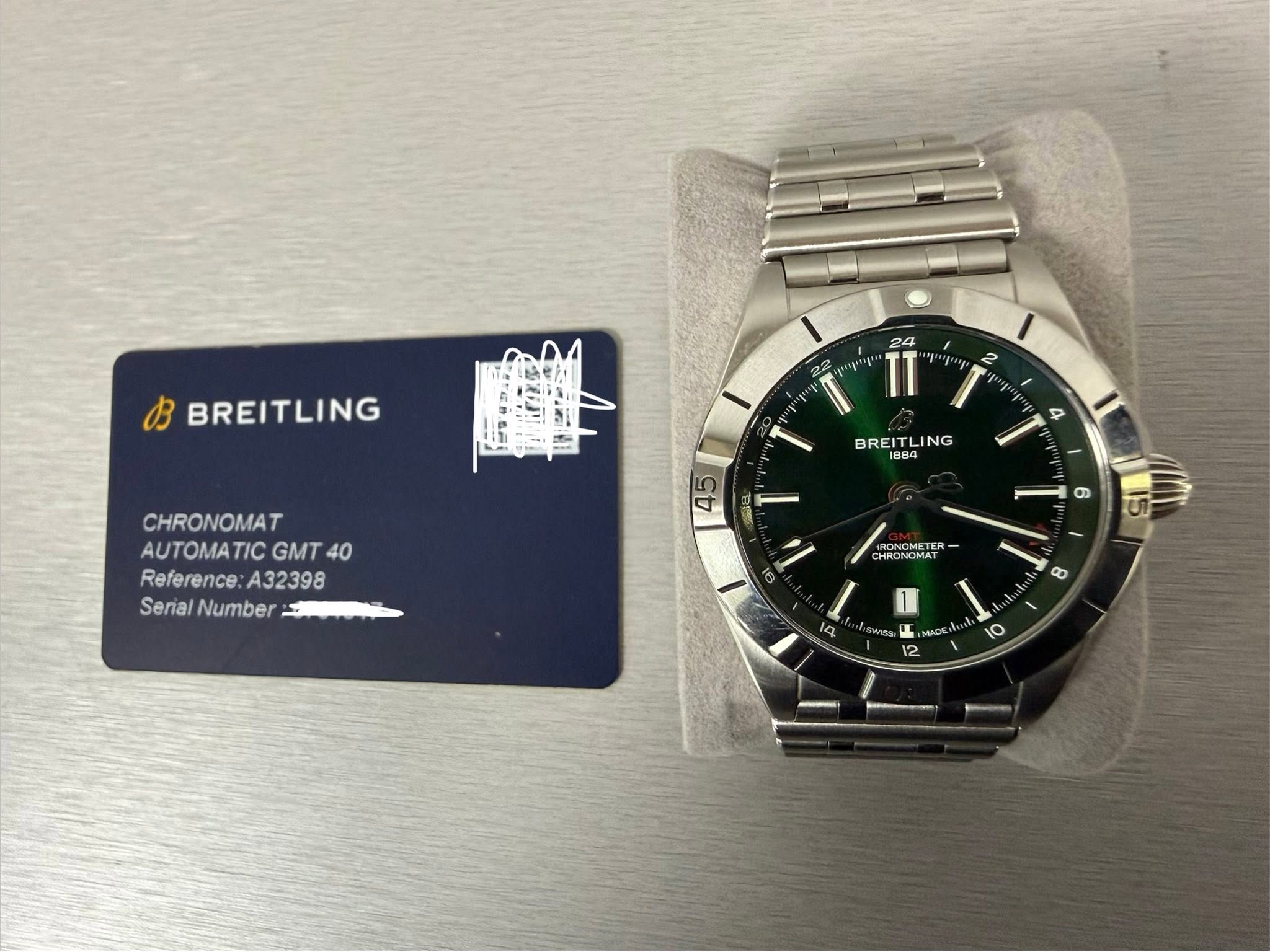 May be an image of wrist watch and text that says 'B BREITLING 22 24 TT T' 2 BREITLING BREI LING 1004 4 CHRONOMAT AUTOMATIC GMT 40 Reference A32398 Serial SerialNumber Number 45 ว…