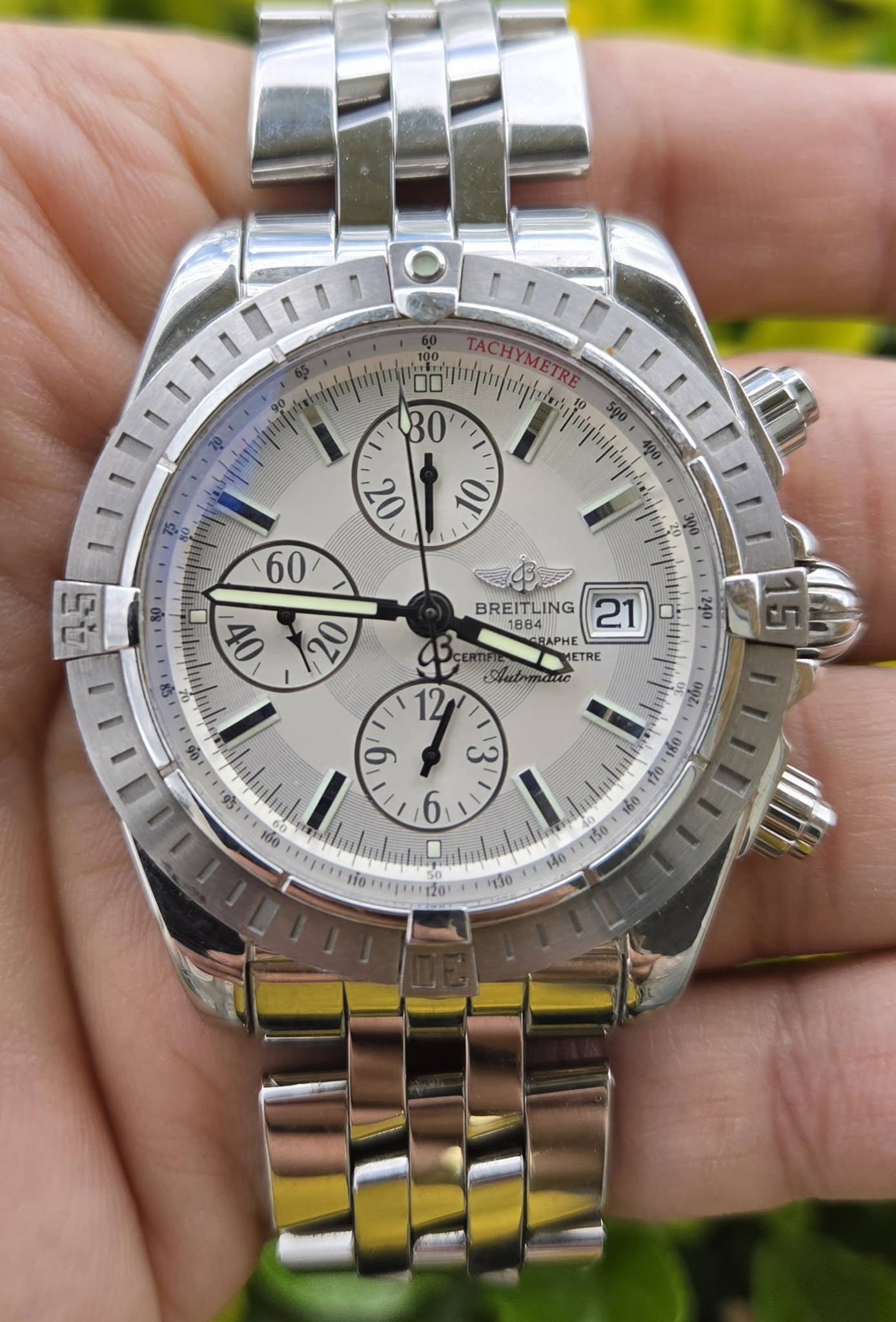 May be an image of wrist watch and text that says 'TACHY) TACHYMETRE ETRE 50 90 ψψηи, 心 300 o7 00 BREITLING BREIAA LING 21 ባጠ OVE 1240 BREITL 1884 BAPHE METRE TRE Autrmane . ی…