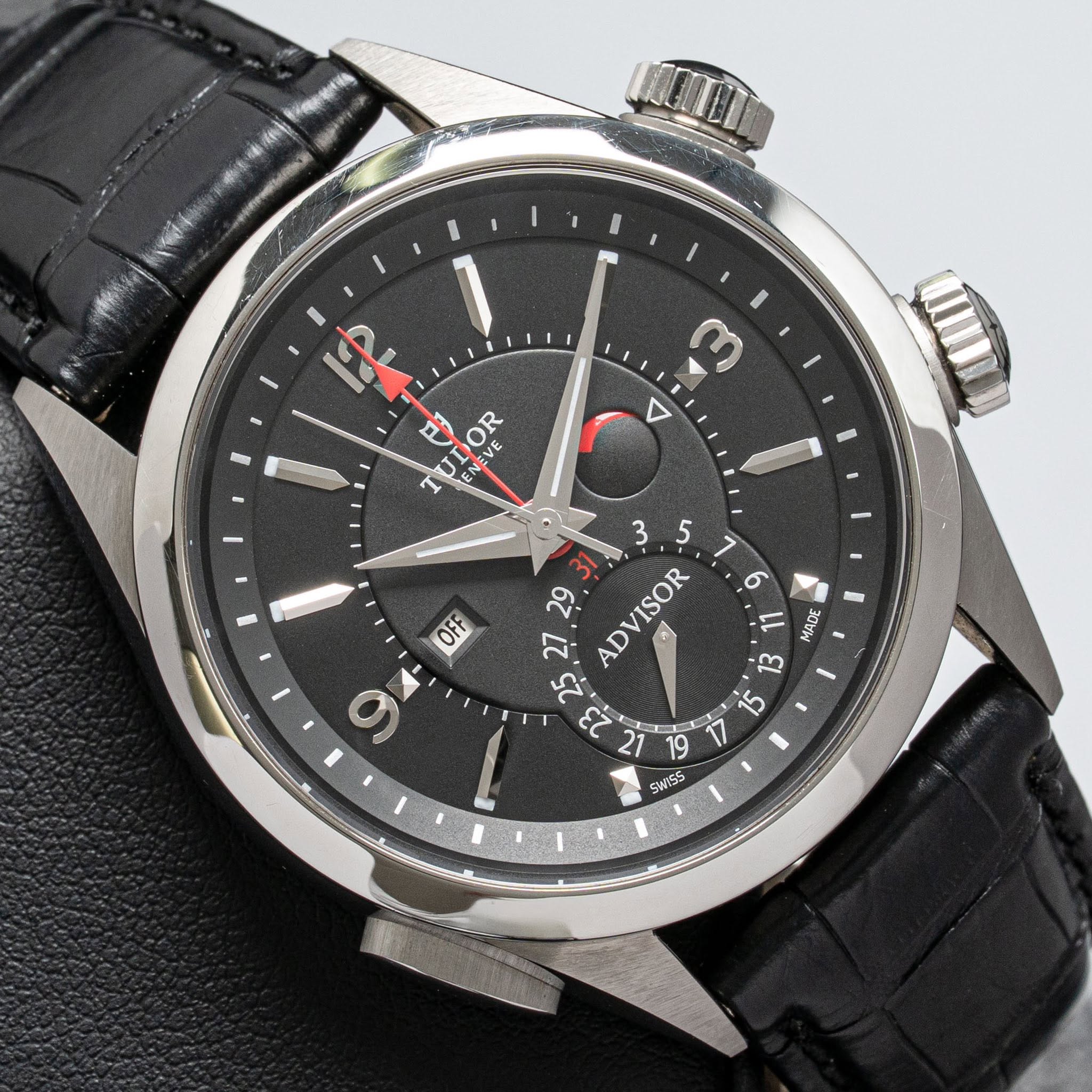 May be an image of wrist watch and text that says 'aжHe e な ന 4 TOR L o 9 3 5 29 ADVISOR 27 2. 23 OFF 9 U 30V 13 2 5 SWISS'