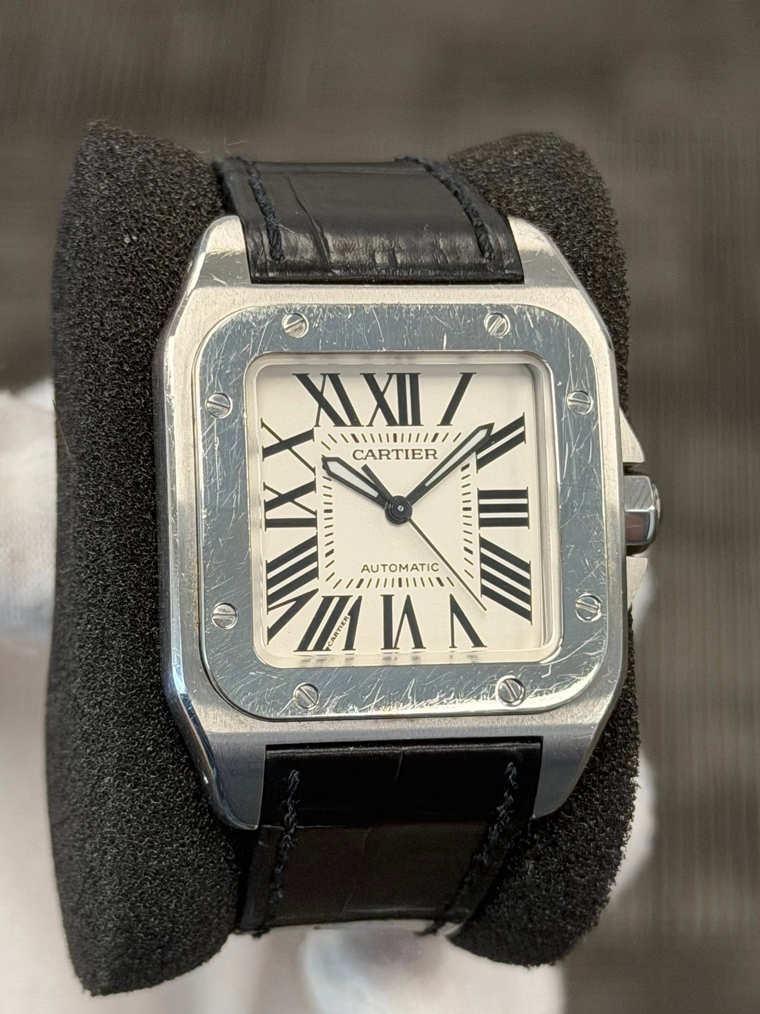 May be an image of wrist watch and text