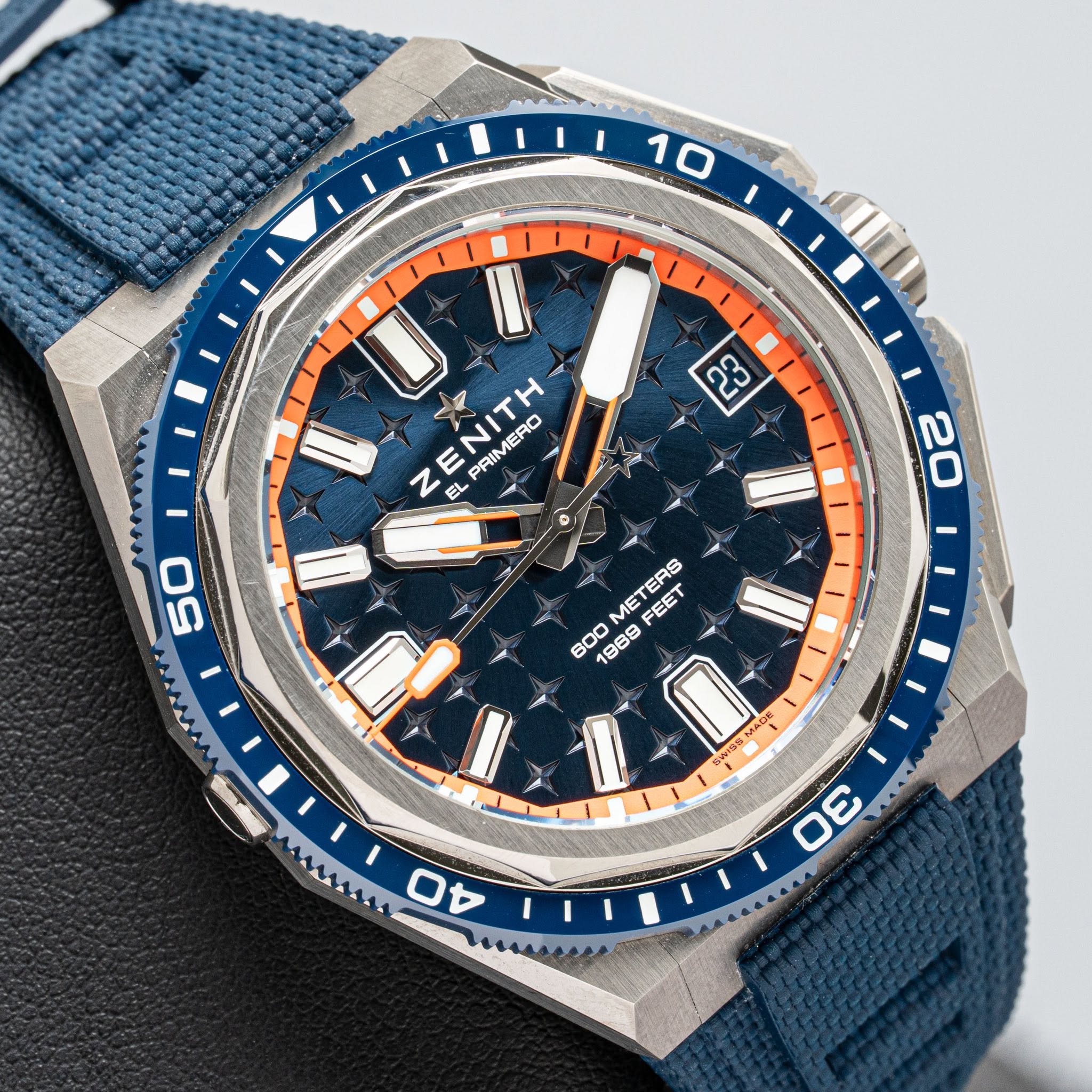 May be an image of wrist watch and text that says 'I 10 2 ကာ 1 z ENITH EL PRIM PRIMERO ERO EL 50 20 METERS FEET 600 1988 38E 198 / WSSMAC 915S MA m 3 MAMAAMA ロ'