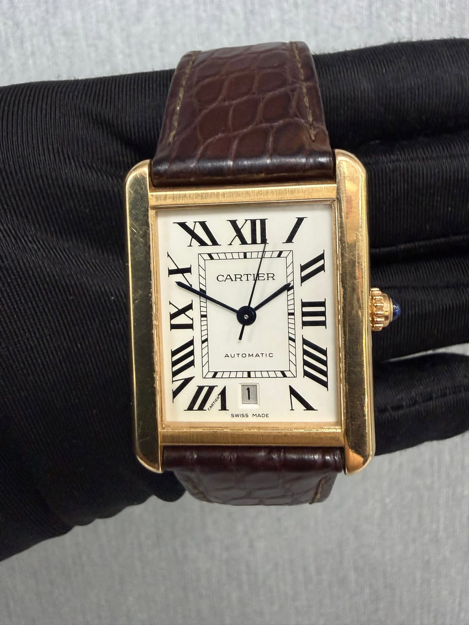 May be an image of wrist watch and text