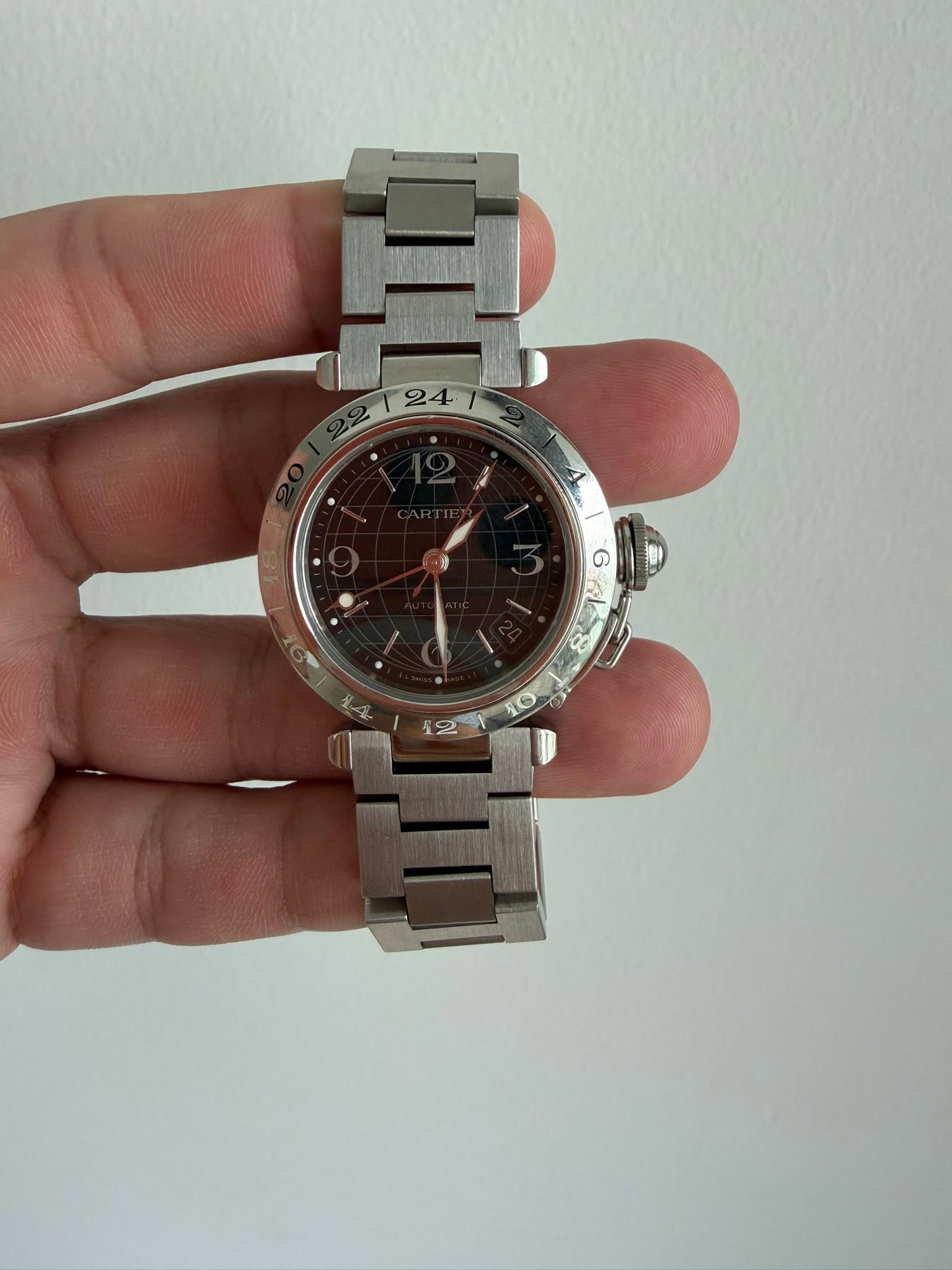 May be an image of wrist watch and text