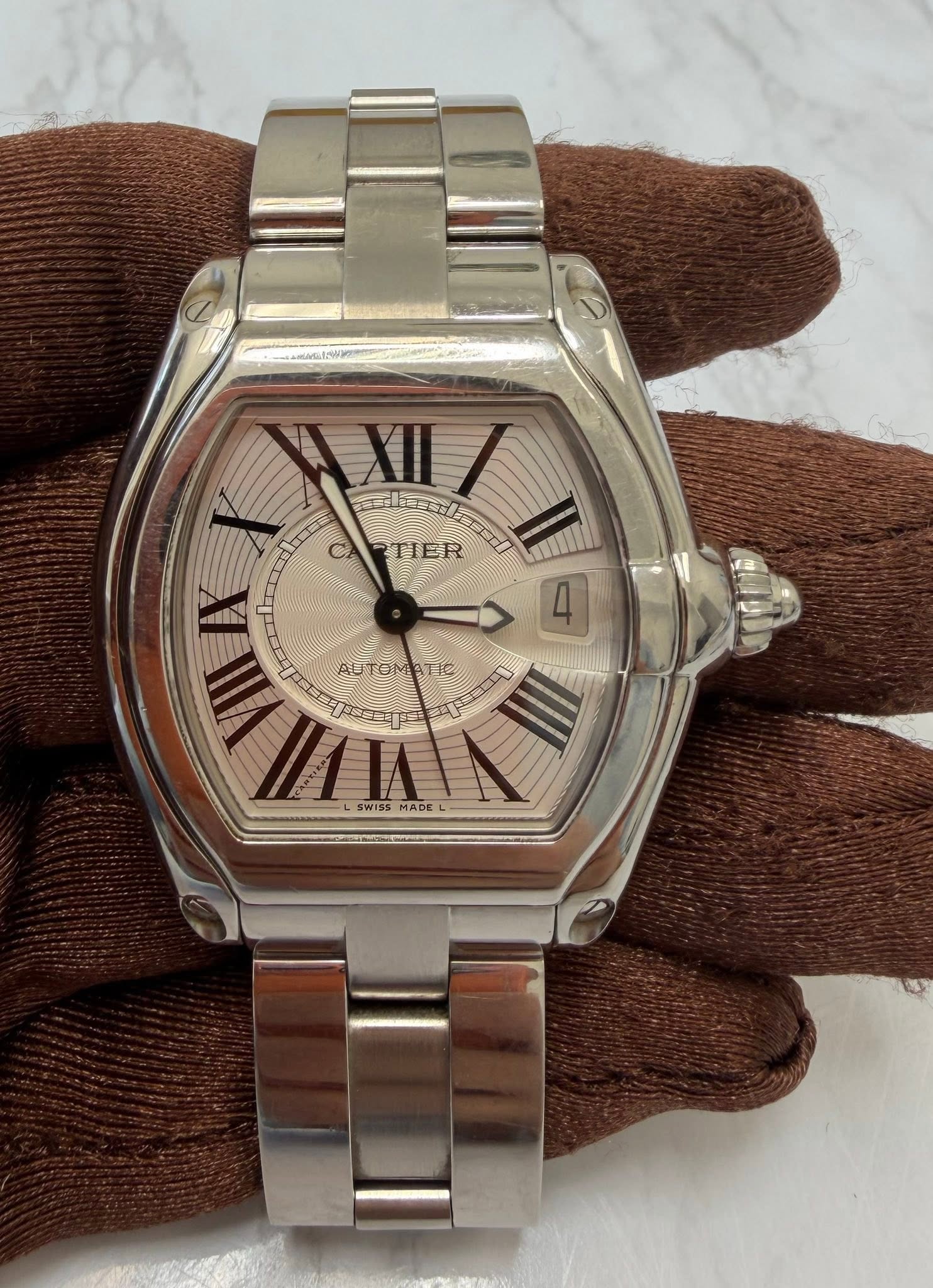 May be an image of wrist watch and text