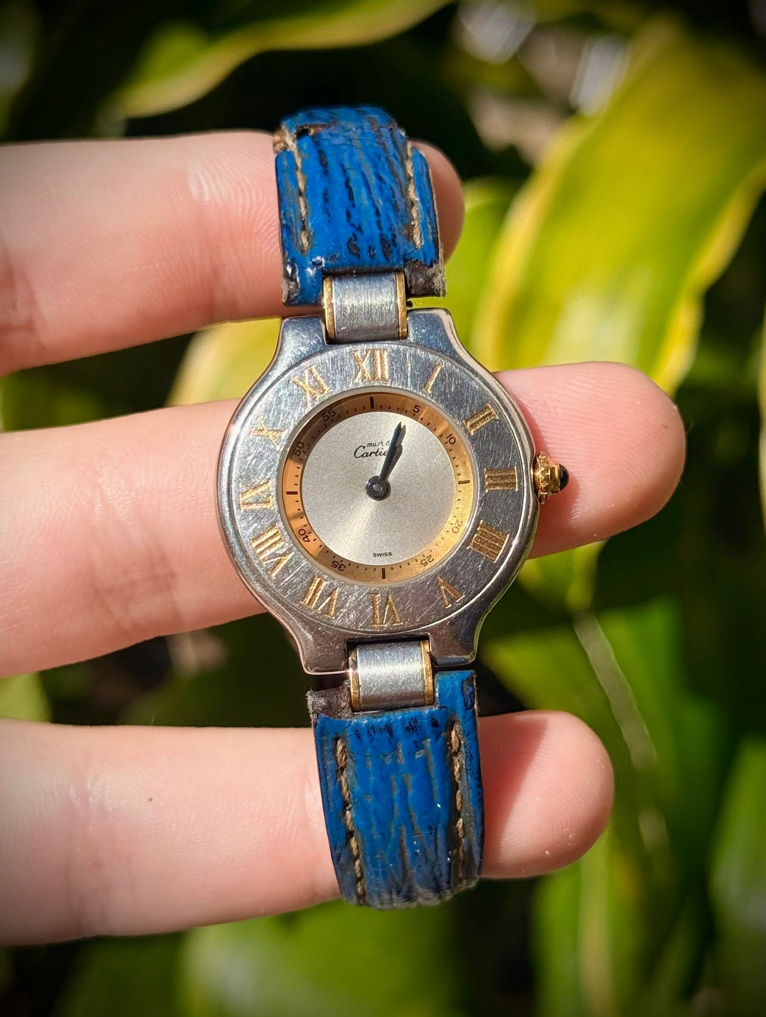 May be an image of wrist watch and text