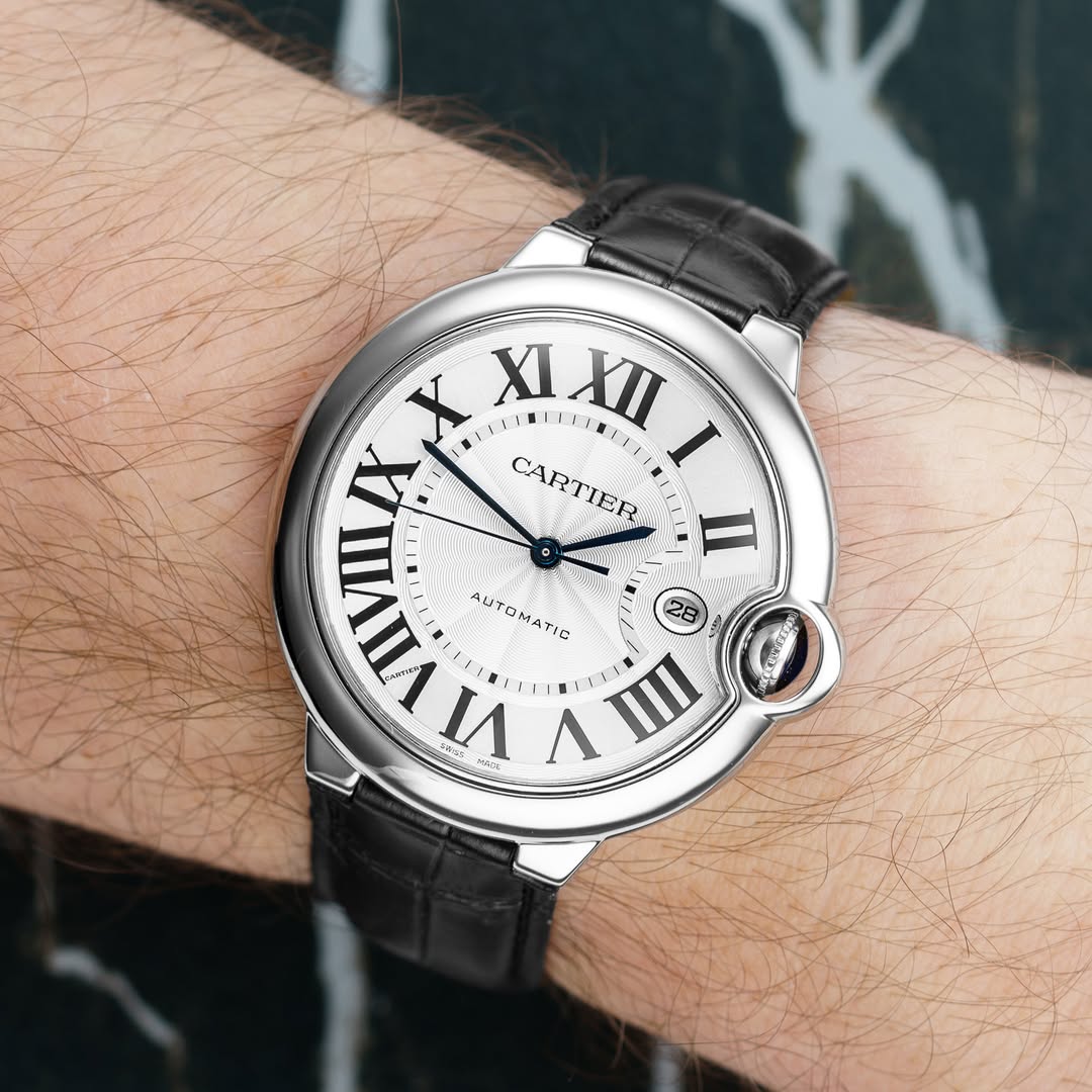 May be an image of wrist watch and text