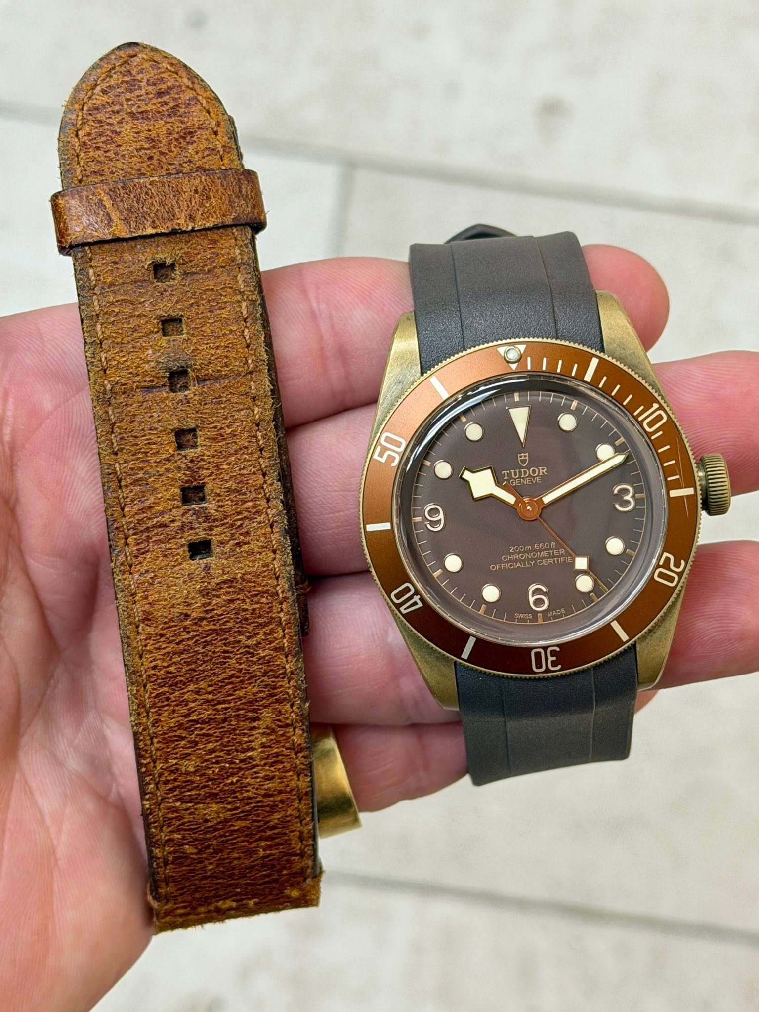 May be an image of saddle-stitched leather, leather, wrist watch and text