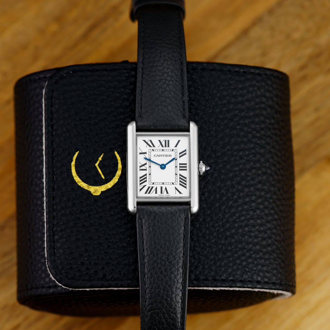 May be an image of wrist watch, leather and text that says 'XLXIA ل XLXII XI XII CARTICR មញ III pr. س is III nΑΙA'