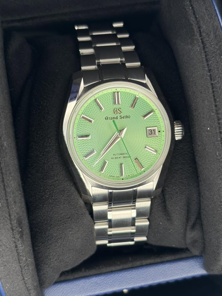 May be an image of wrist watch and text