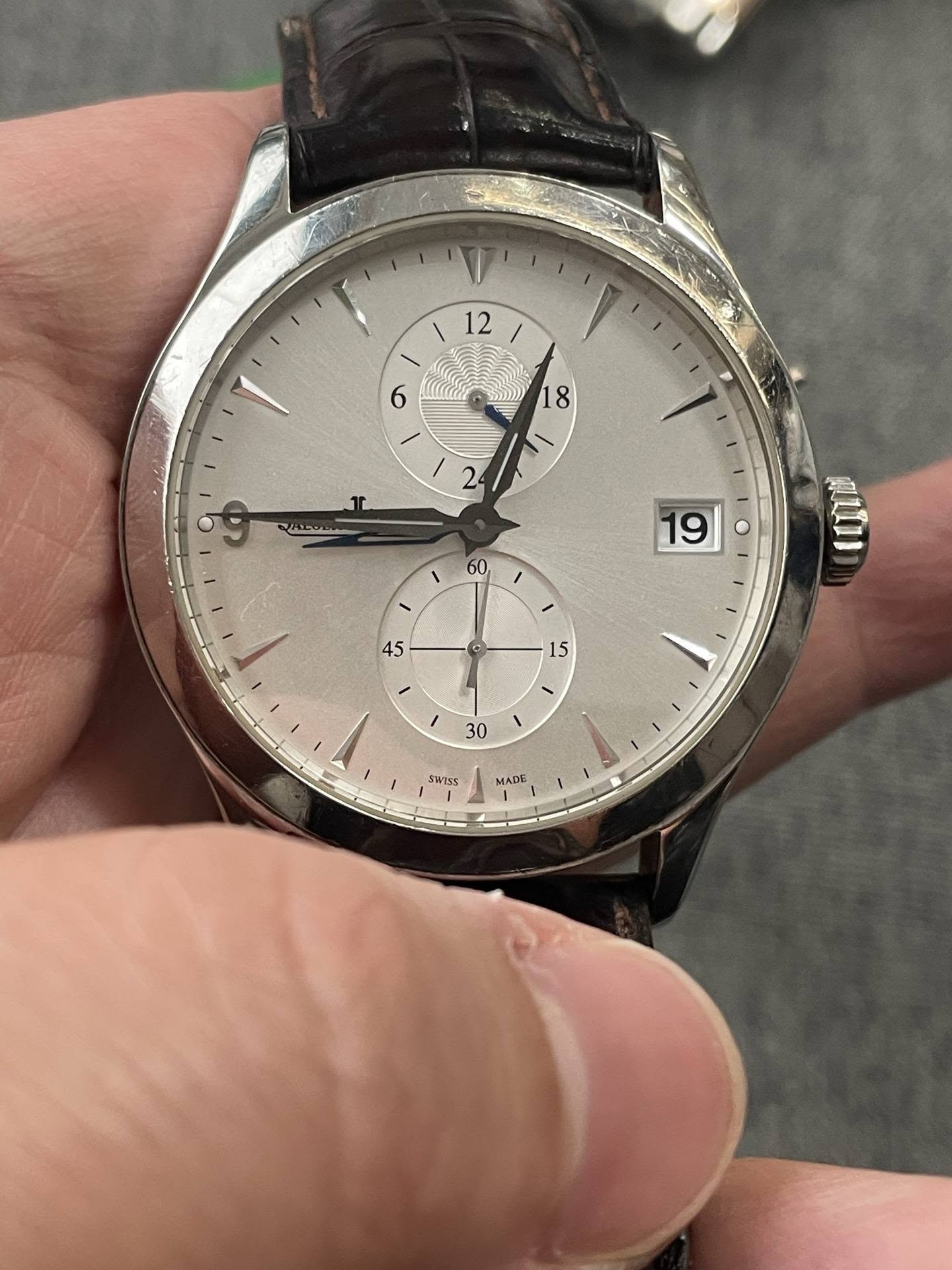 May be an image of wrist watch and text