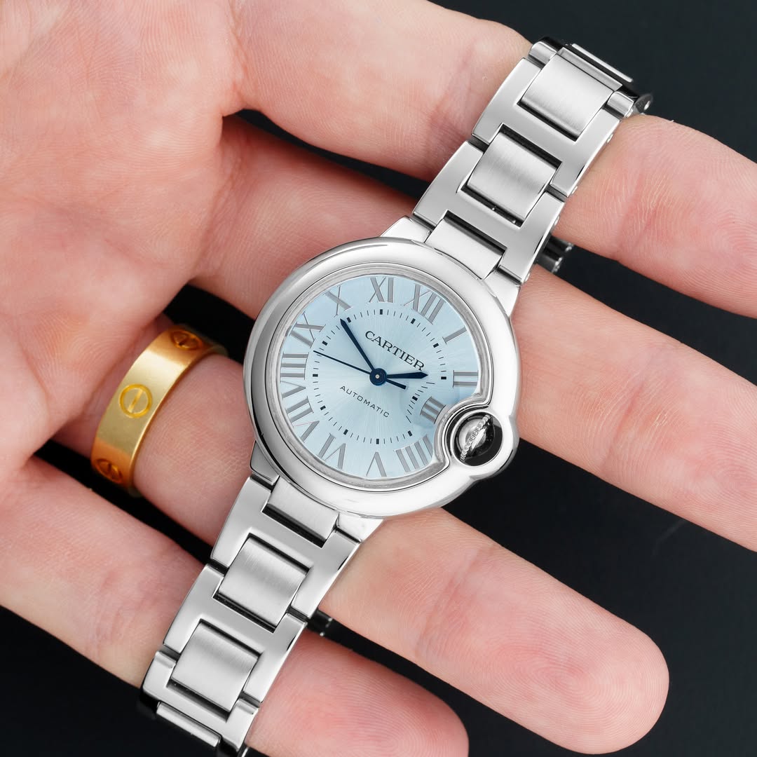 May be an image of wrist watch, strap, timer and text