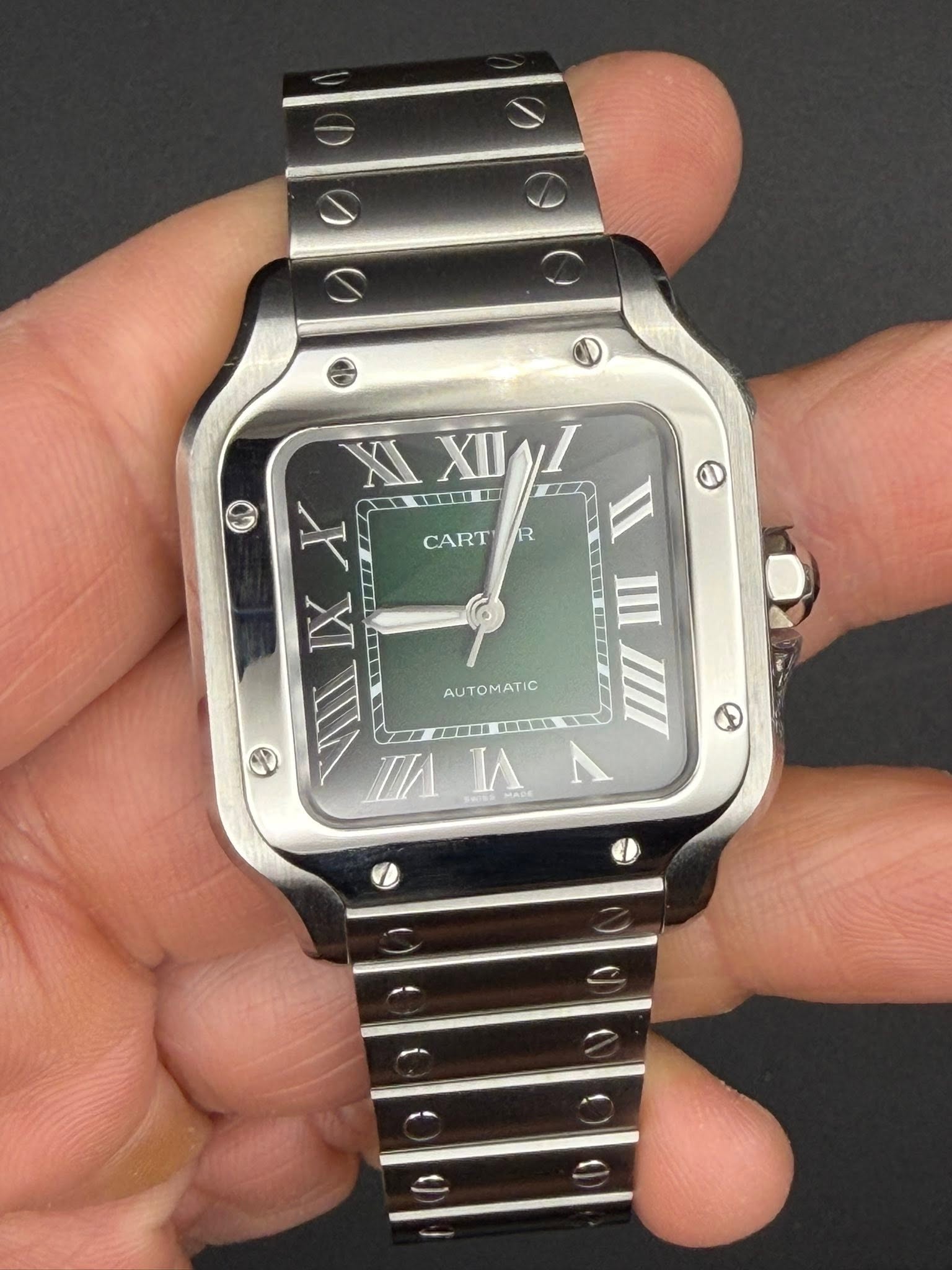 May be an image of wrist watch and text