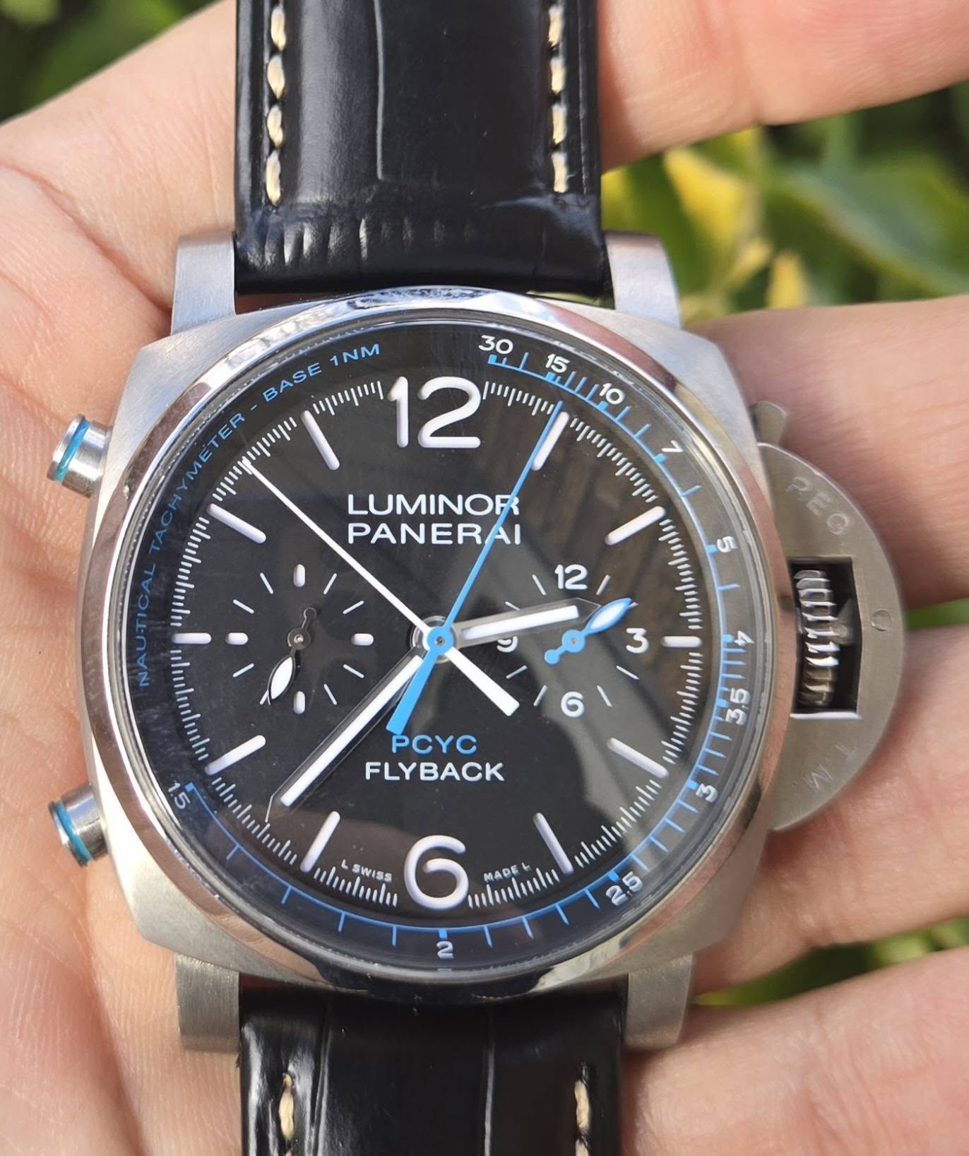 May be an image of wrist watch and text