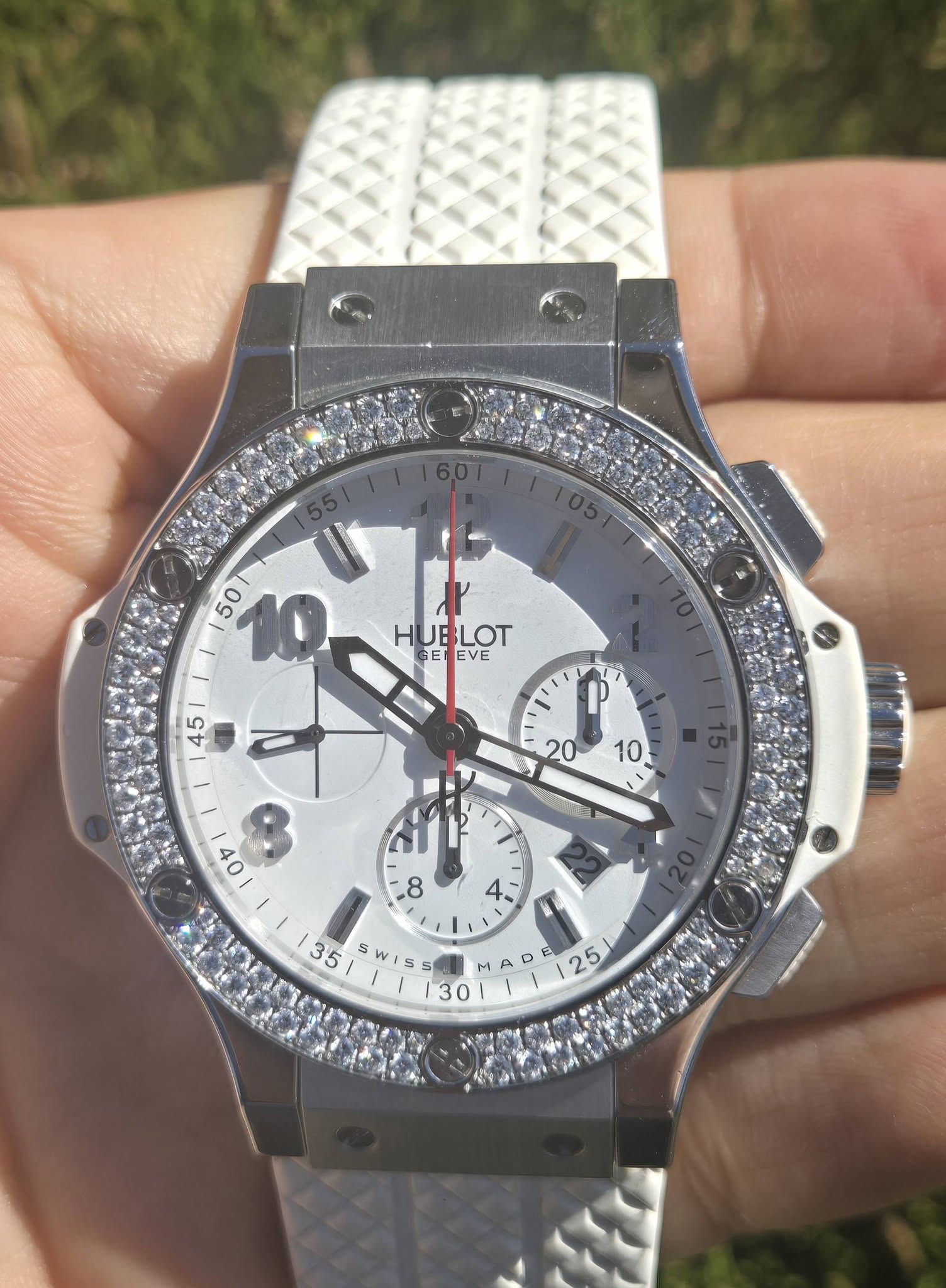 May be an image of wrist watch and text