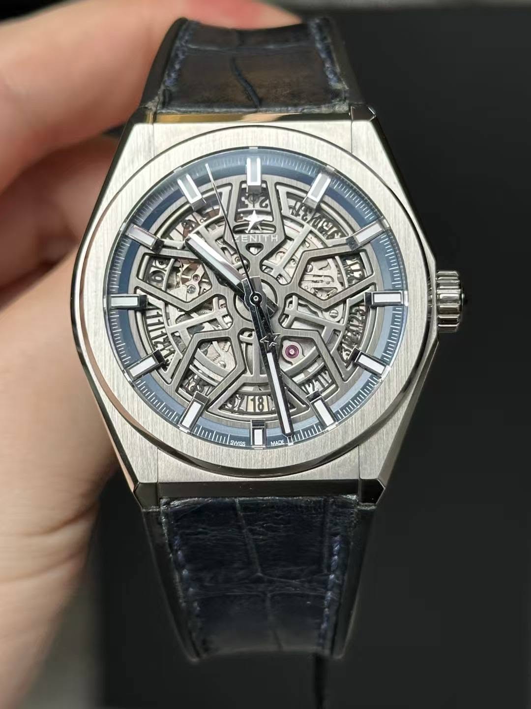 May be an image of wrist watch and text
