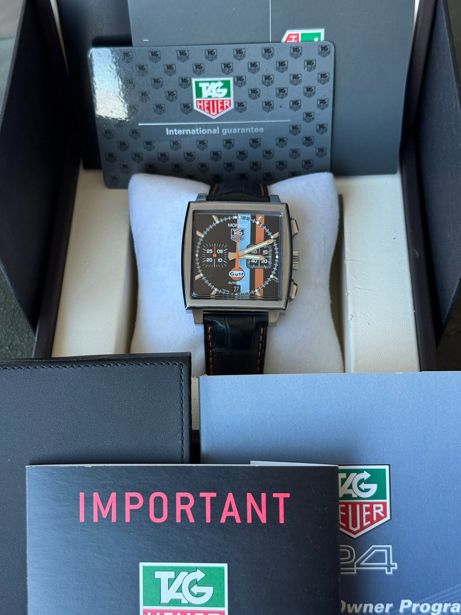May be an image of digital watch and text that says '工 TAG HEUER International Internationalguarantee guarantee 25 05 0 S Gult IMPORTANT TAG AG UER 一 ER wner erProgra Progra wner'