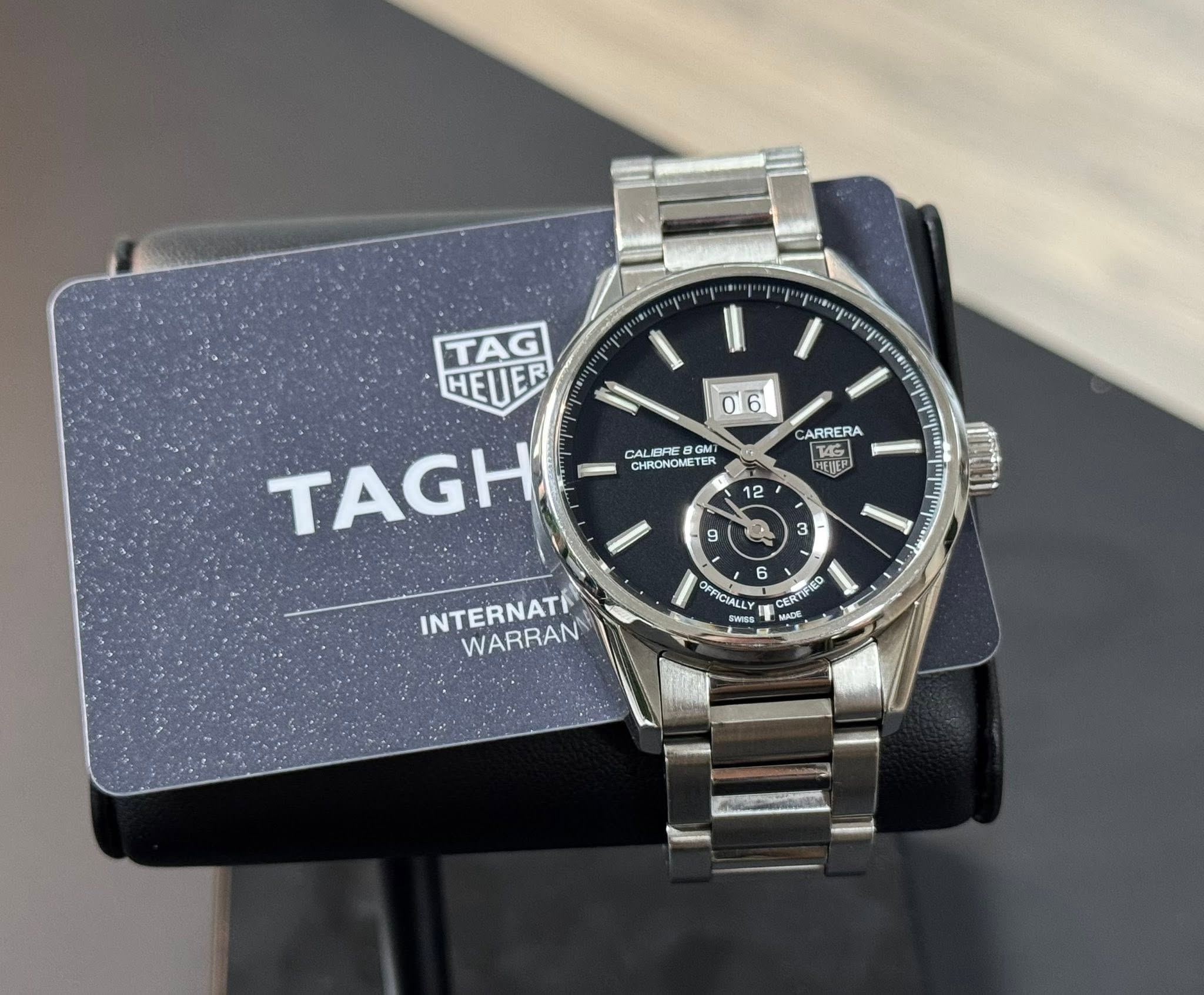 May be an image of wrist watch and text that says 'TAG HEUER TAGH 0 06 6 CAI CALEK BRI GMI CHRONOMETI TER ARRERA T4G س 12 9 3 6 FFICIALL OTIEO 60 CIALL IE CERTEIRO CERU IN CO…