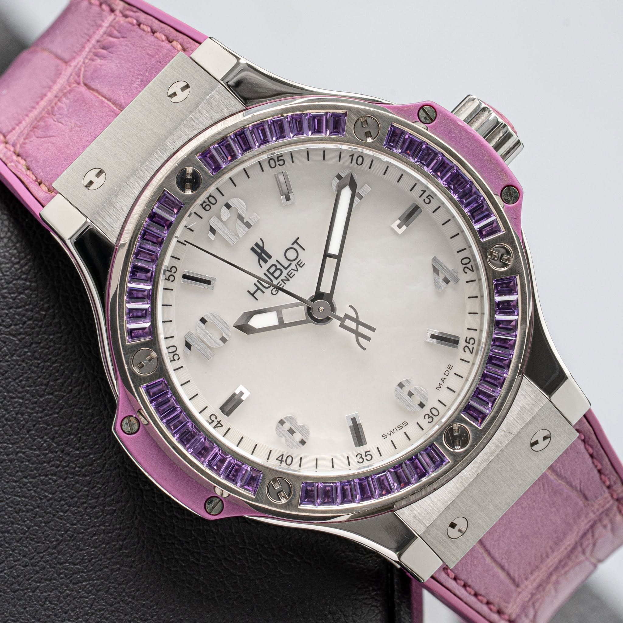 May be an image of wrist watch and text